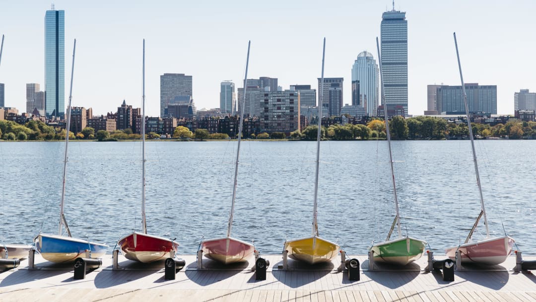 View of Boston skyline from Griffin's Wharf with several sailboats in the foreground.