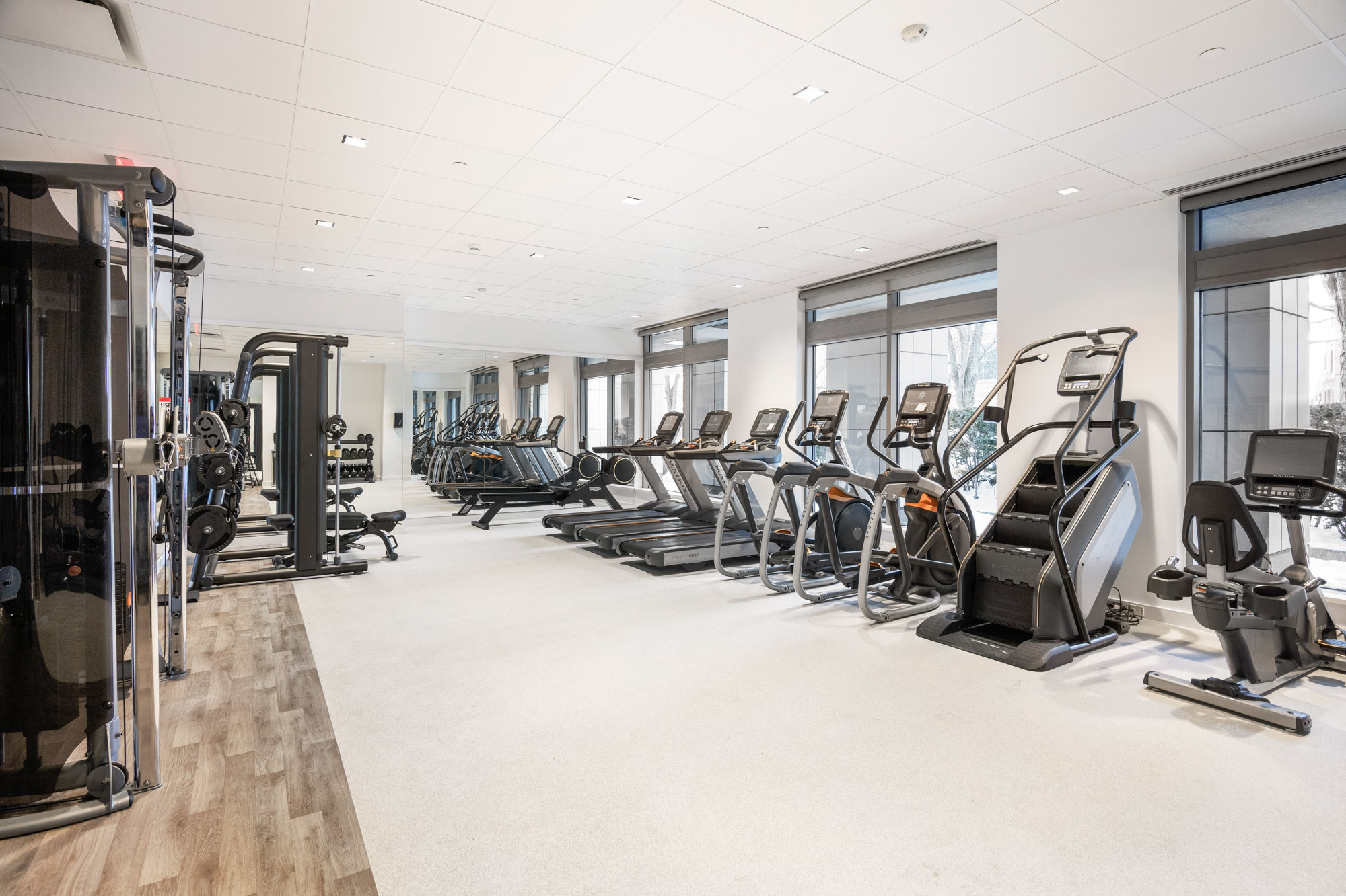 Fitness center exercise machines at 100 Landsdowne Street Apartments