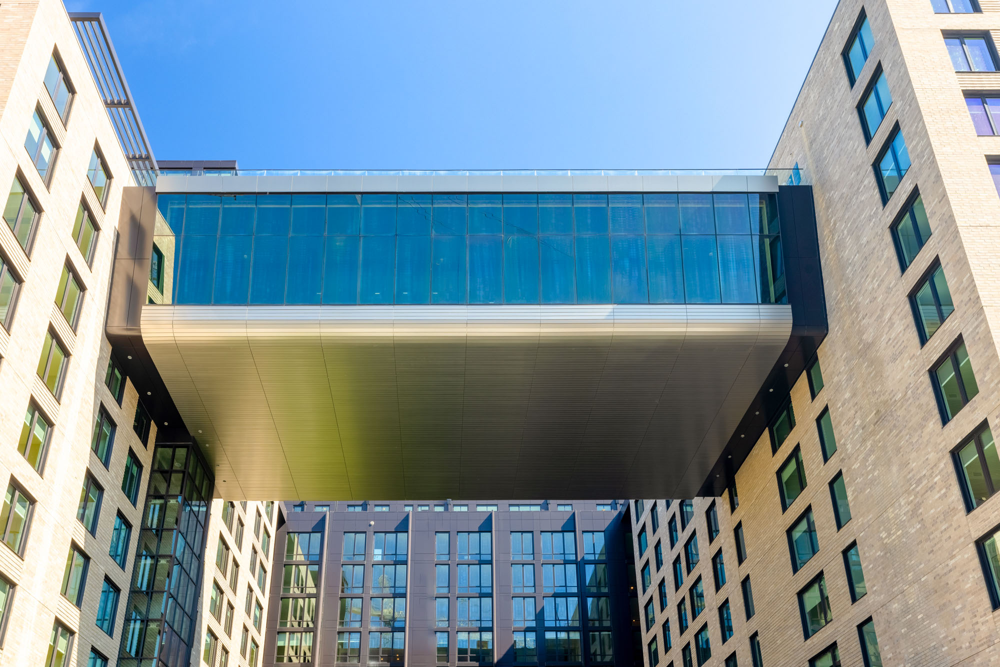 The double-heigh glass bridge fitness center at Vela apartments in The Yards in Washington, DC.