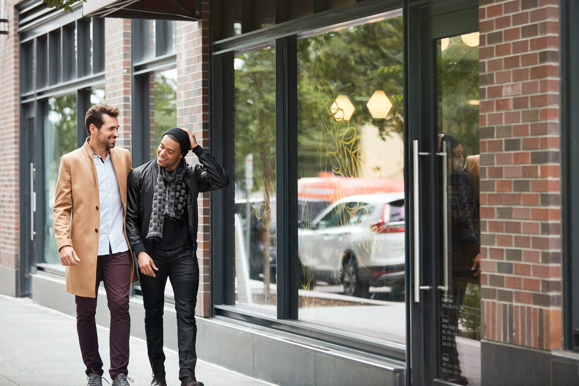 People walking to a restaurant near Guild apartments at The Yards in Washington, DC.