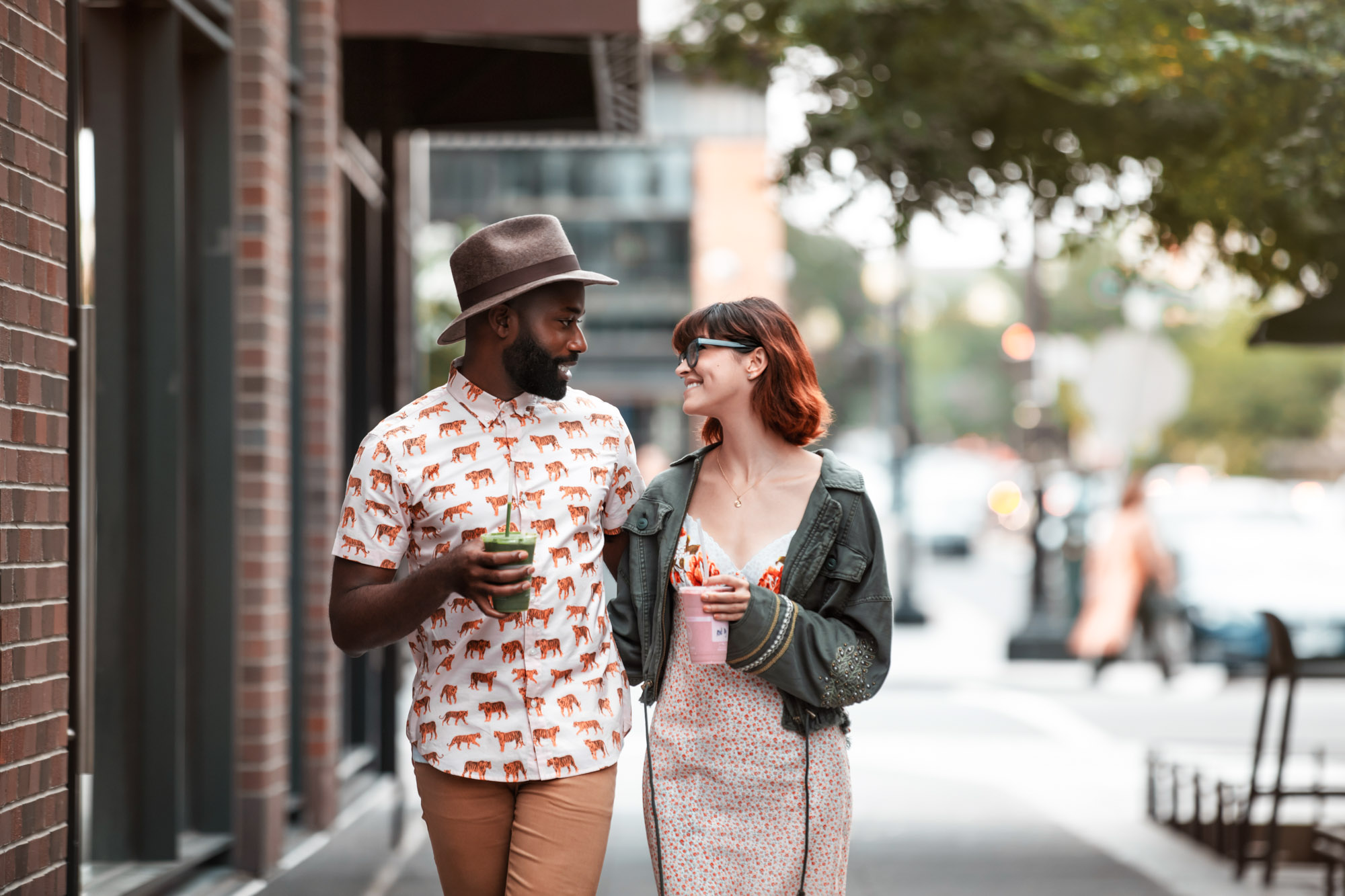 A couple walking near Guild apartments at The Yards in Washington, DC.