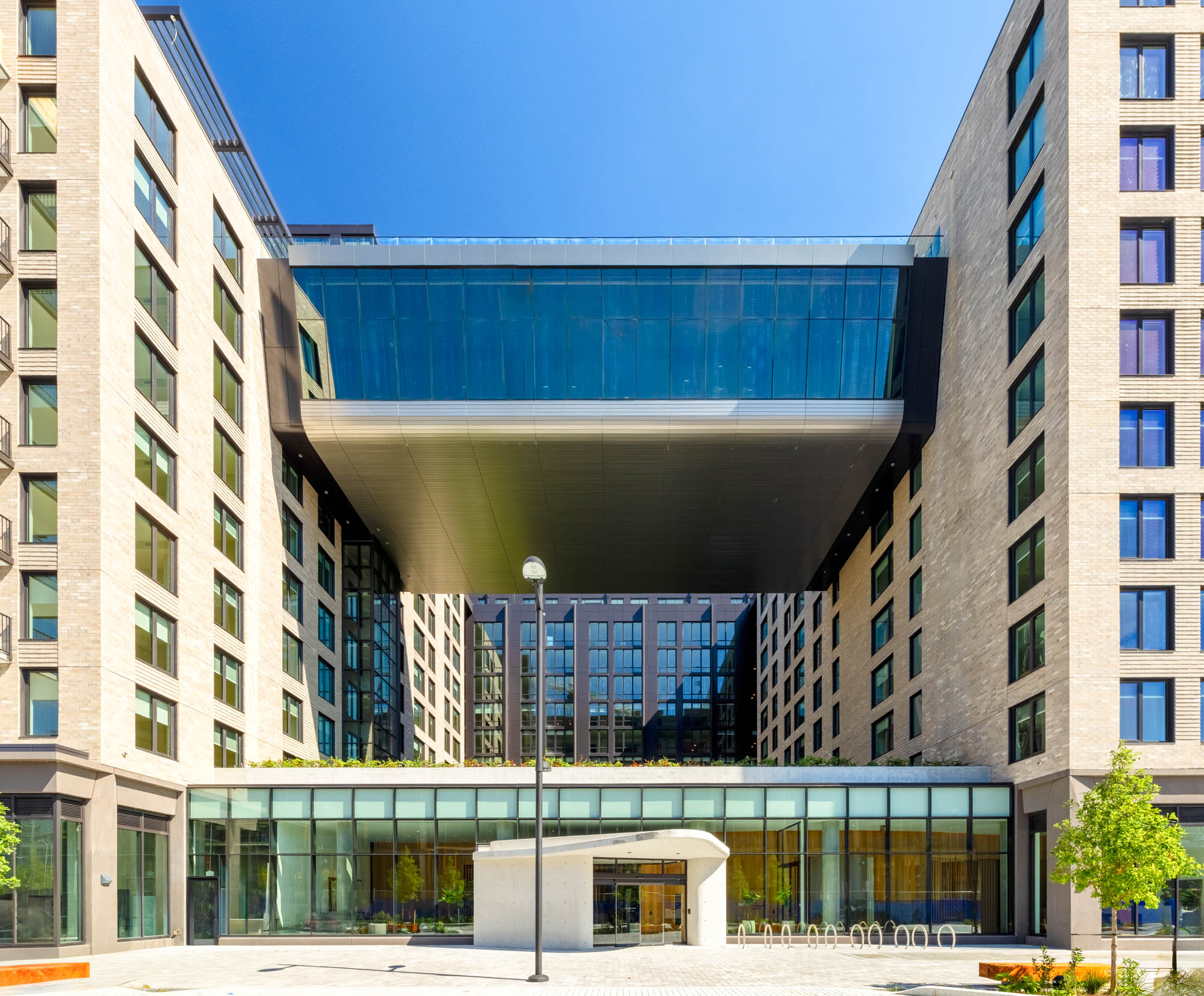 The double-heigh glass bridge fitness center at Vela apartments in The Yards in Washington, DC.