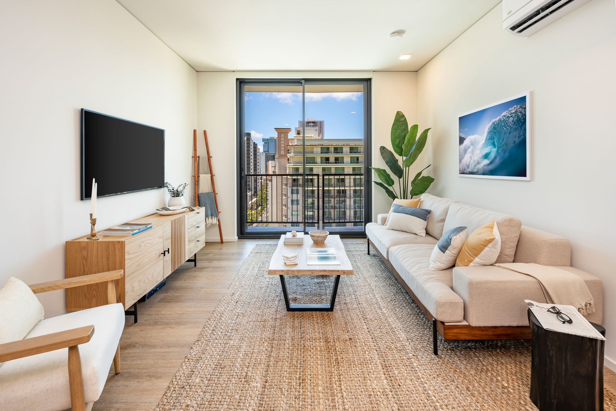 Living room with floor-to-ceiling windows.