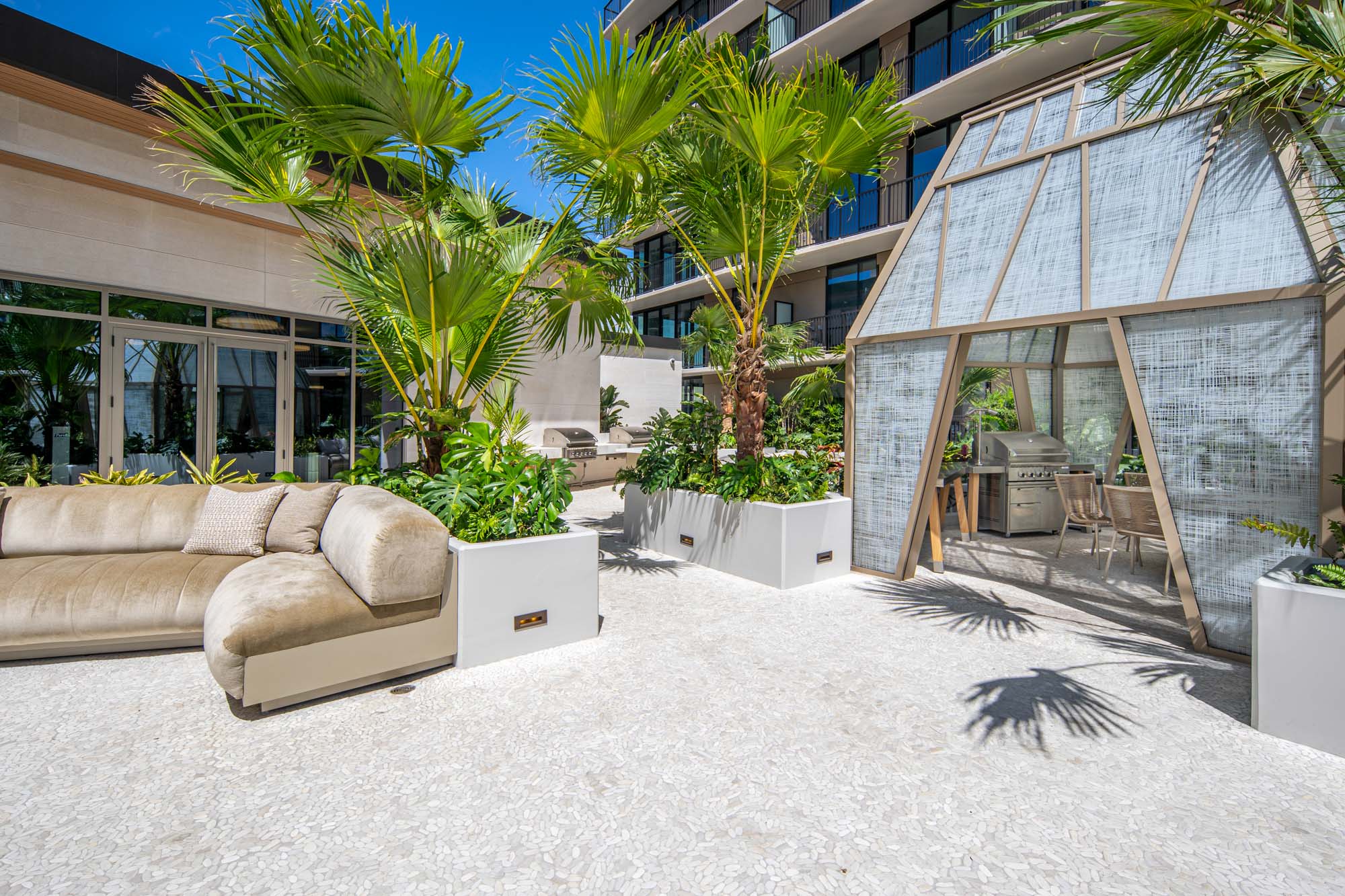 Private cabanas with grill area for outdoor dining.