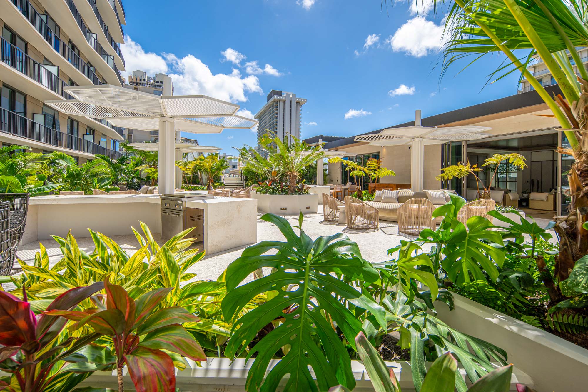 Terrace with grill stations and seating areas.