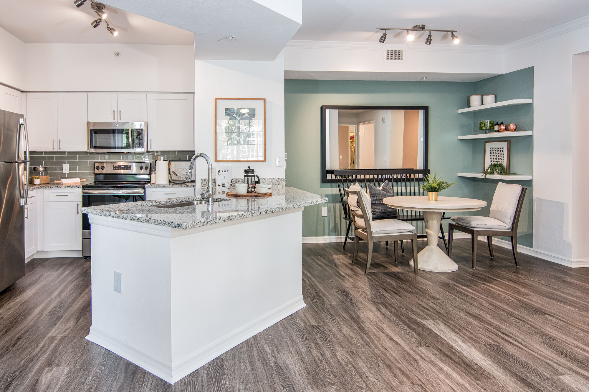 A kitchen and dining area at Solano at Miramar apartments in Miramar, FL.