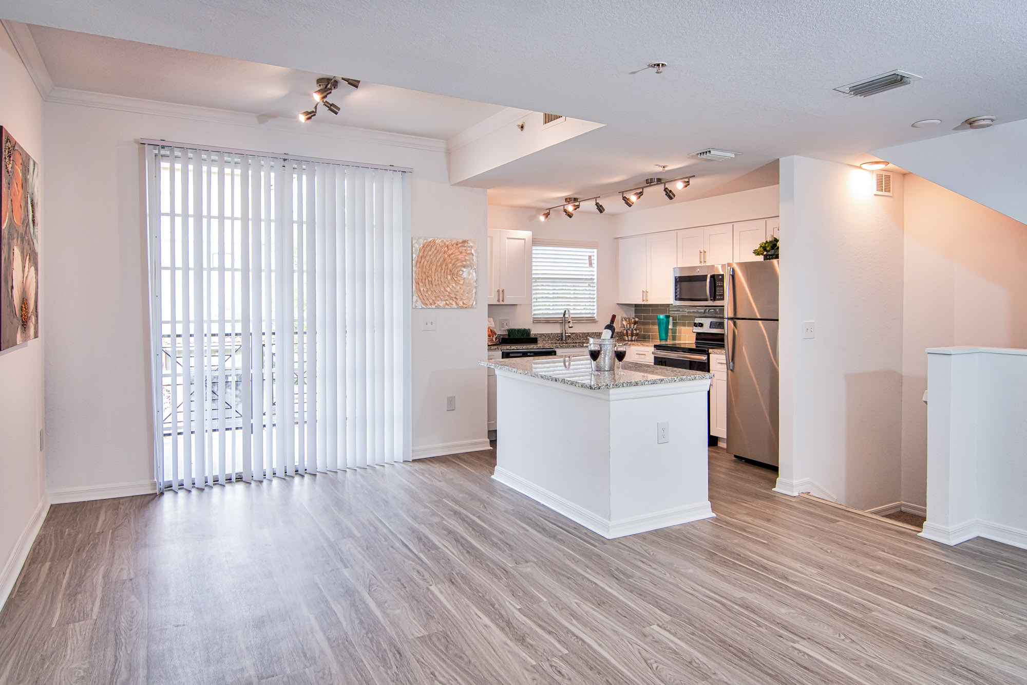 A kitchen and living area at Solano at Miramar apartments in Miramar, FL.