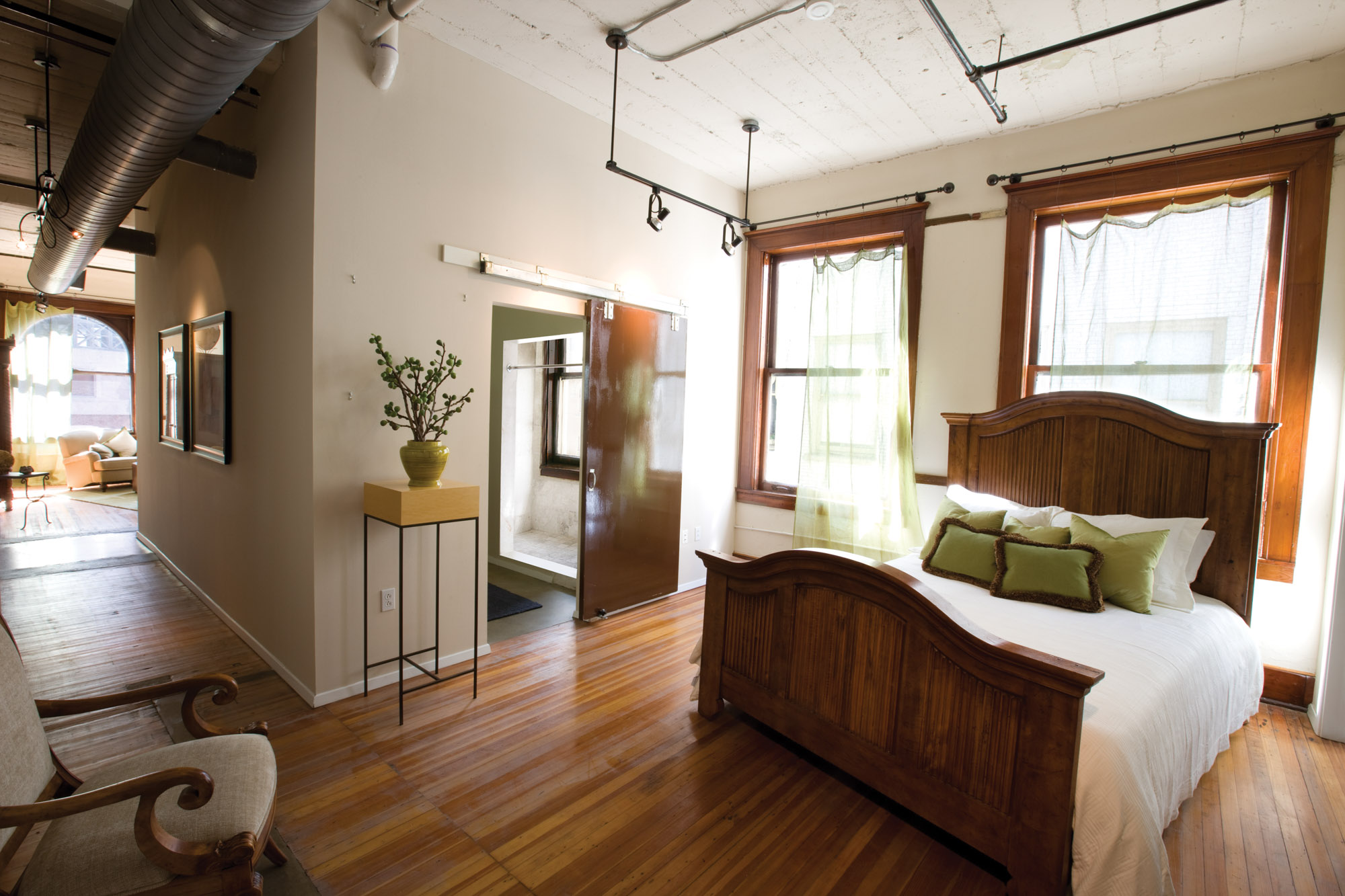 A bedroom at The Wilson apartments in Mercantile Place in Dallas, TX