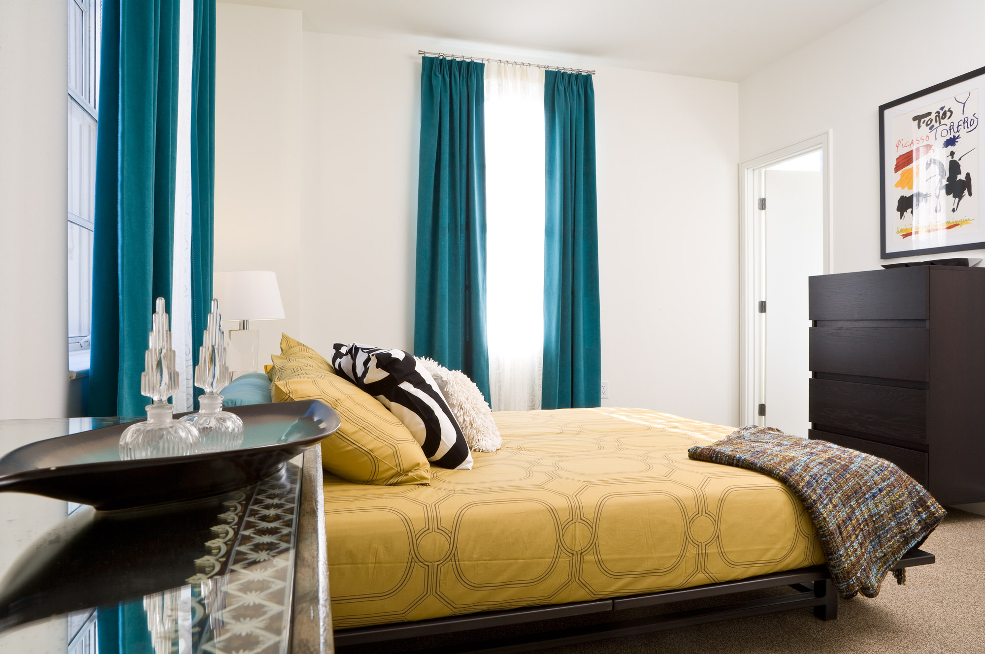 A bedroom at The Merc apartments in Mercantile Place in Dallas, TX