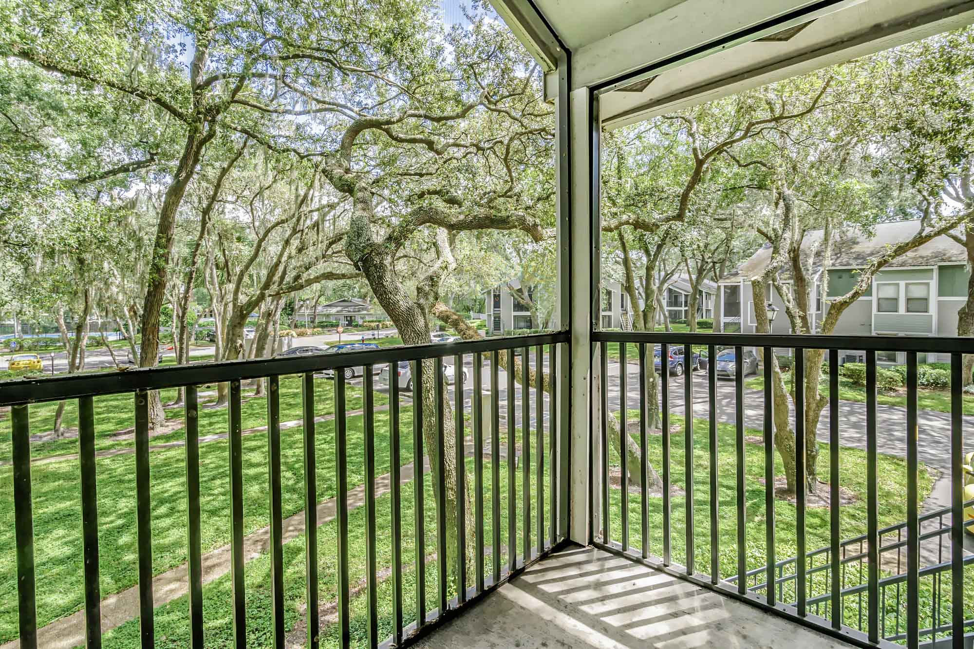 An attached balcony at Oak Ramble apartments in Tampa, FL.