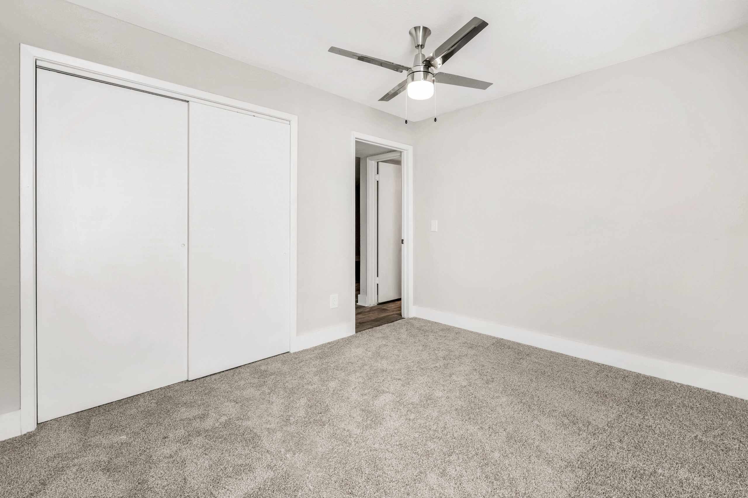 A bedroom at Brookwood Club apartments in Jacksonville, FL.