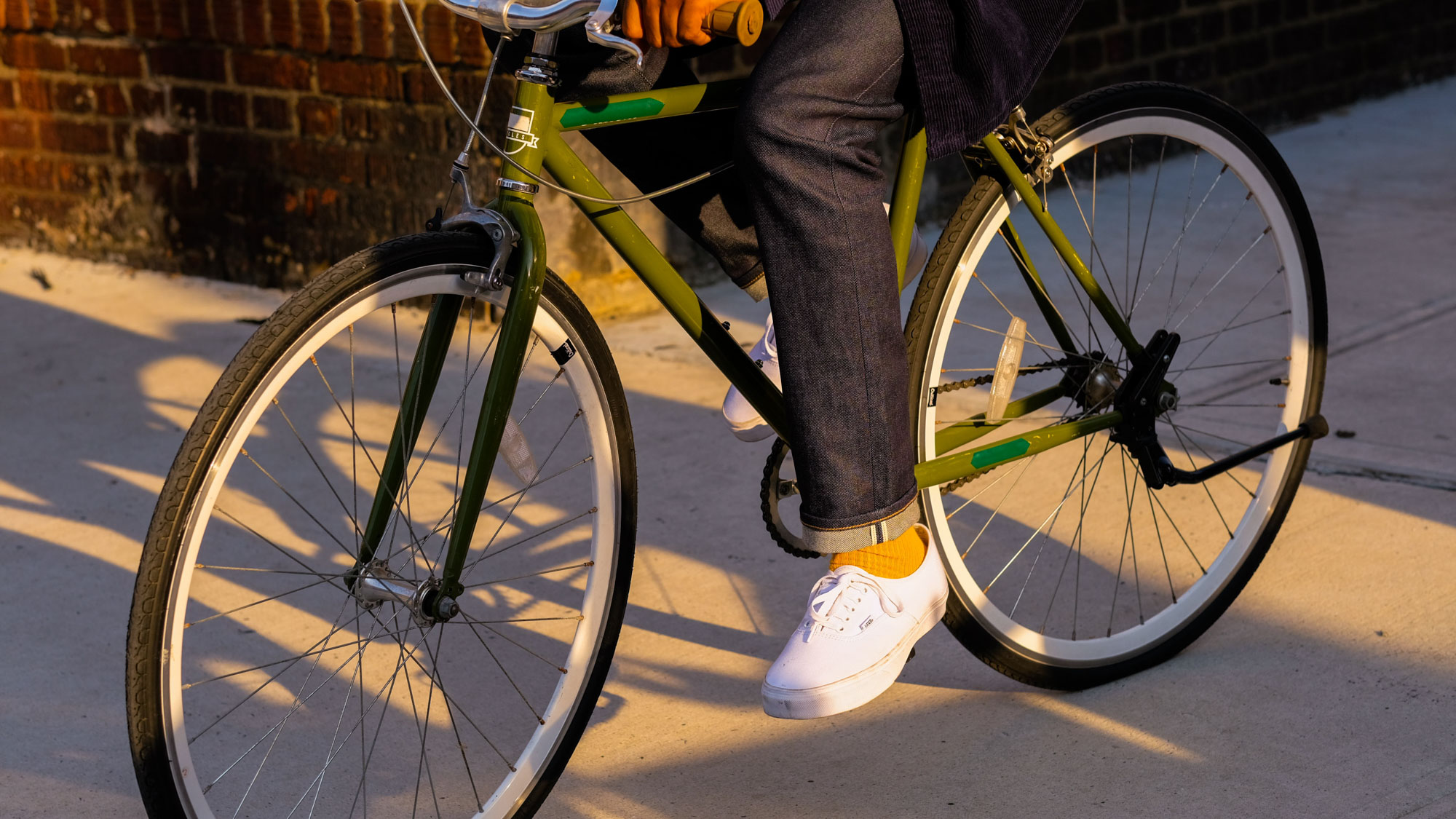 A person riding a bike in Greenpoint Landing in Brooklyn, New York.