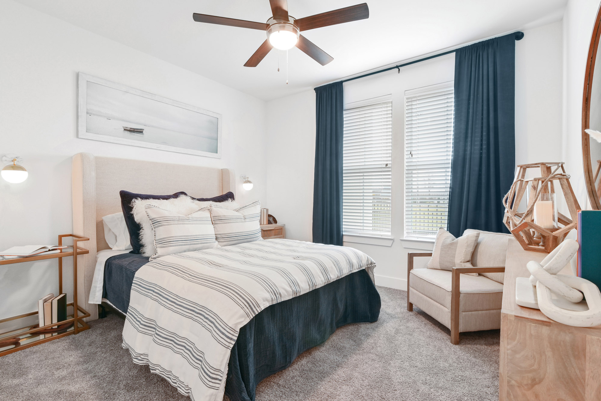 The bedroom of an apartment at Embree Hill in Dallas, TX.