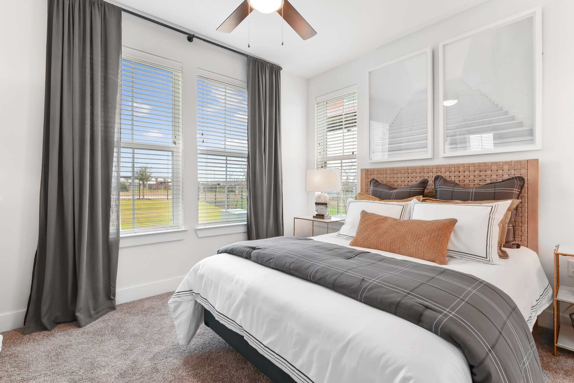 The bedroom of an apartment at Embree Hill in Dallas, TX.