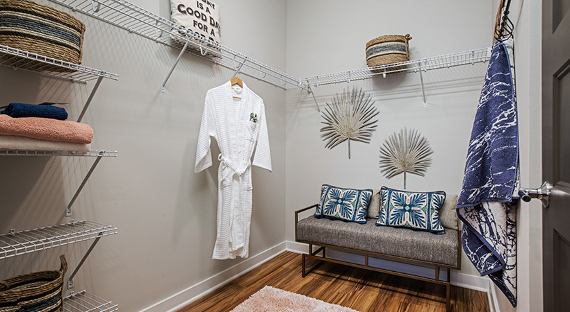 The walk-in closet in a Flats on Front apartment in Wilmington, NC.