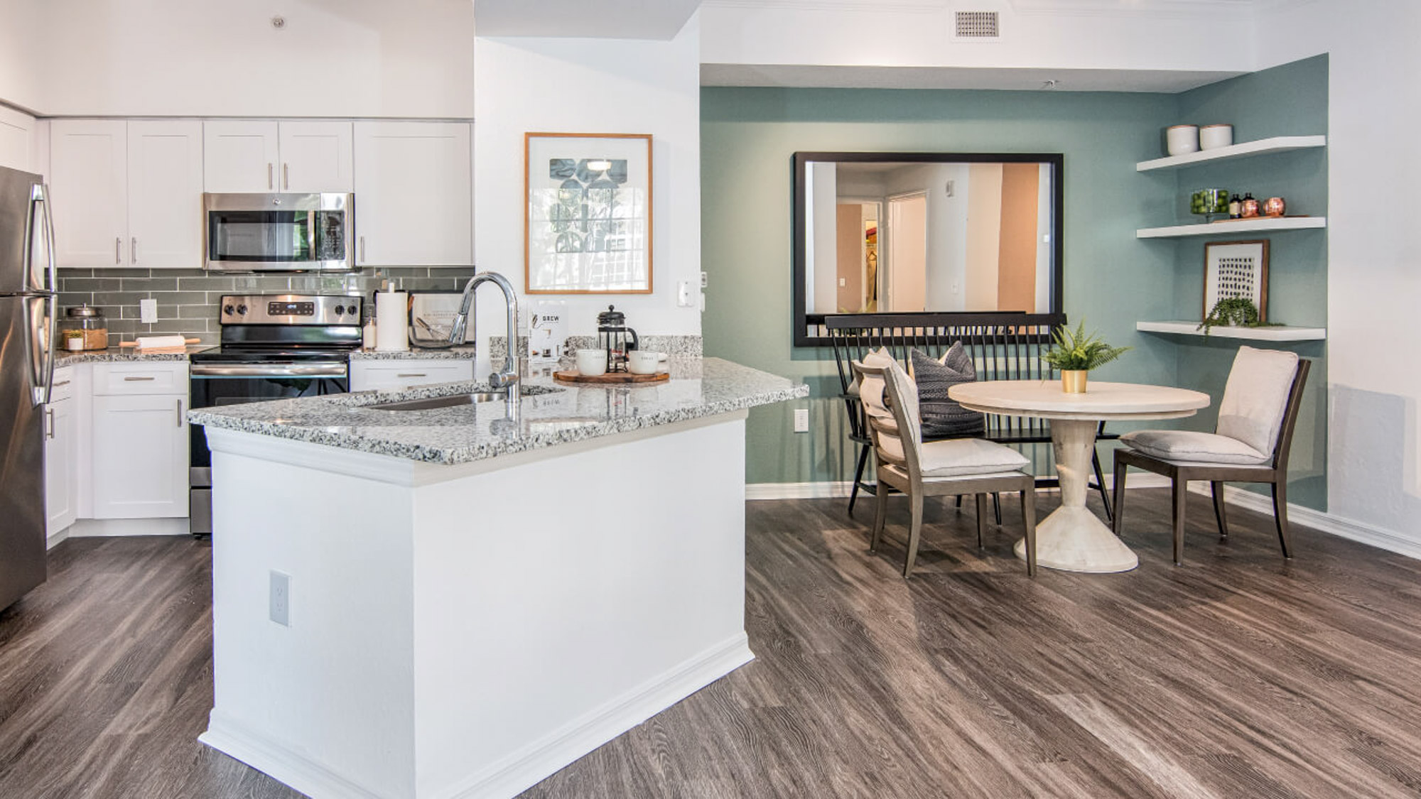 A kitchen and dining area at Solano at Miramar apartments in Miramar, FL.