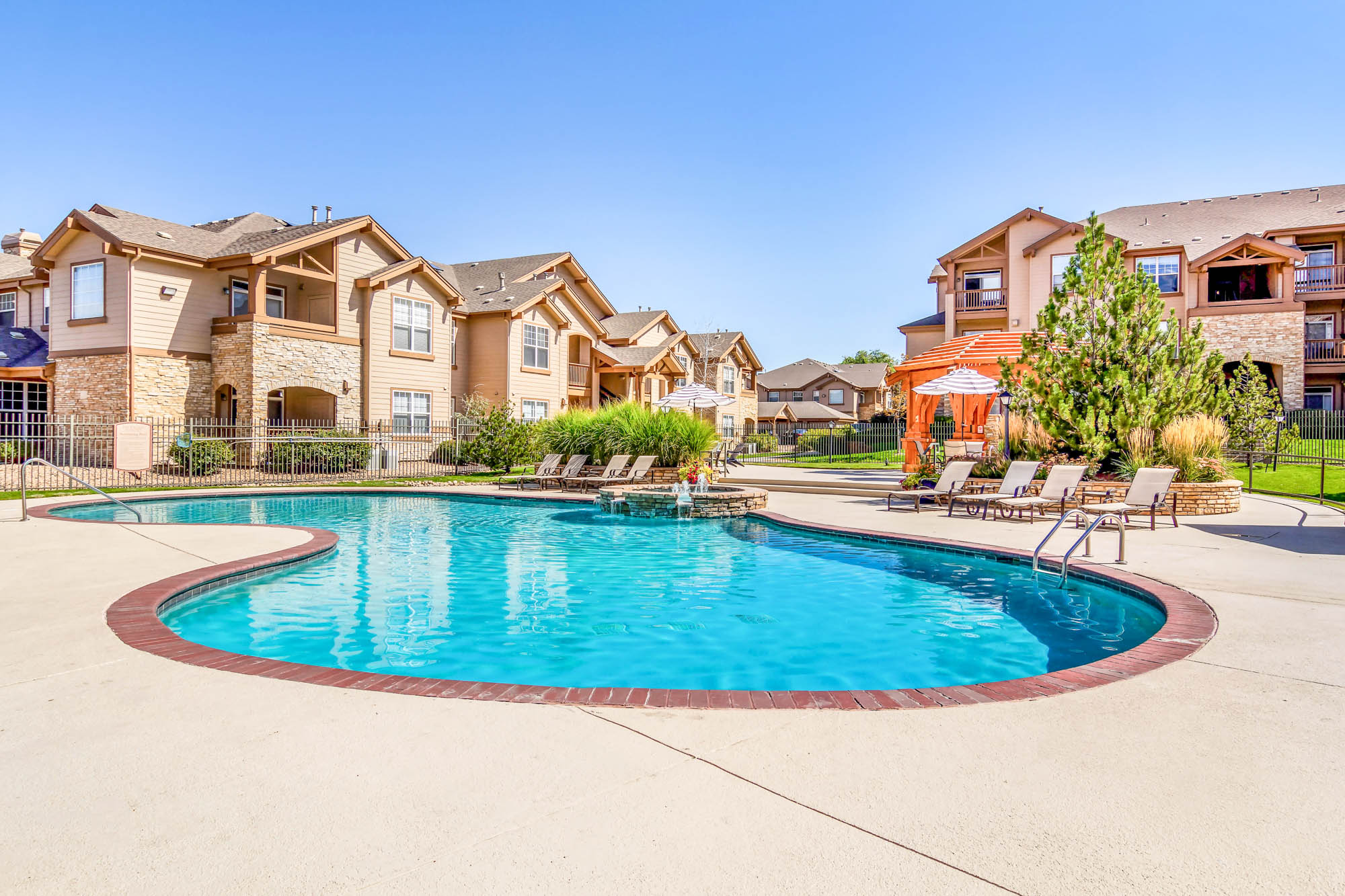 The pool at The Village at Legacy Ridge apartments near Denver, CO.