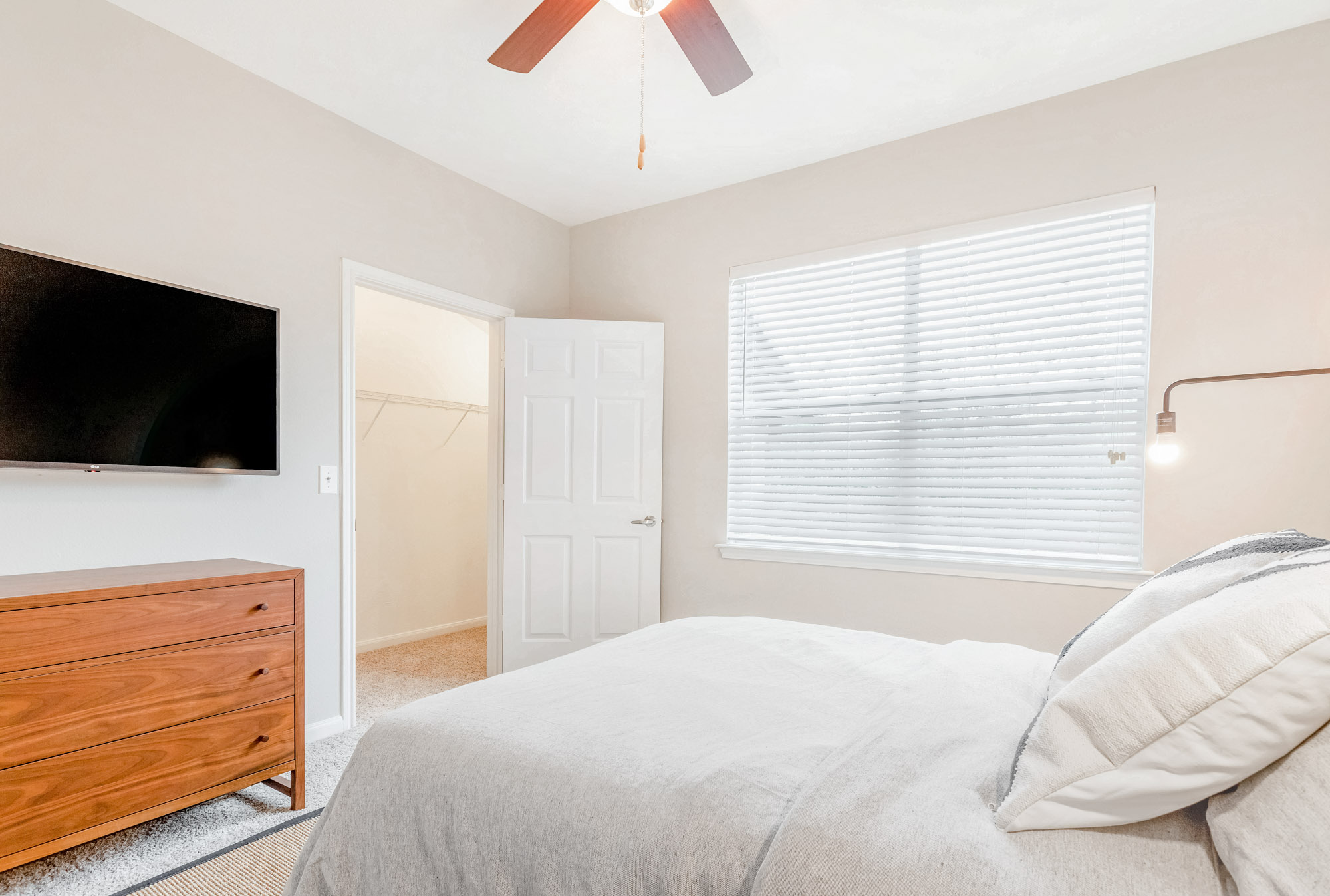 A bedroom at The Villas at Shadow Creek apartments in Houston, TX.