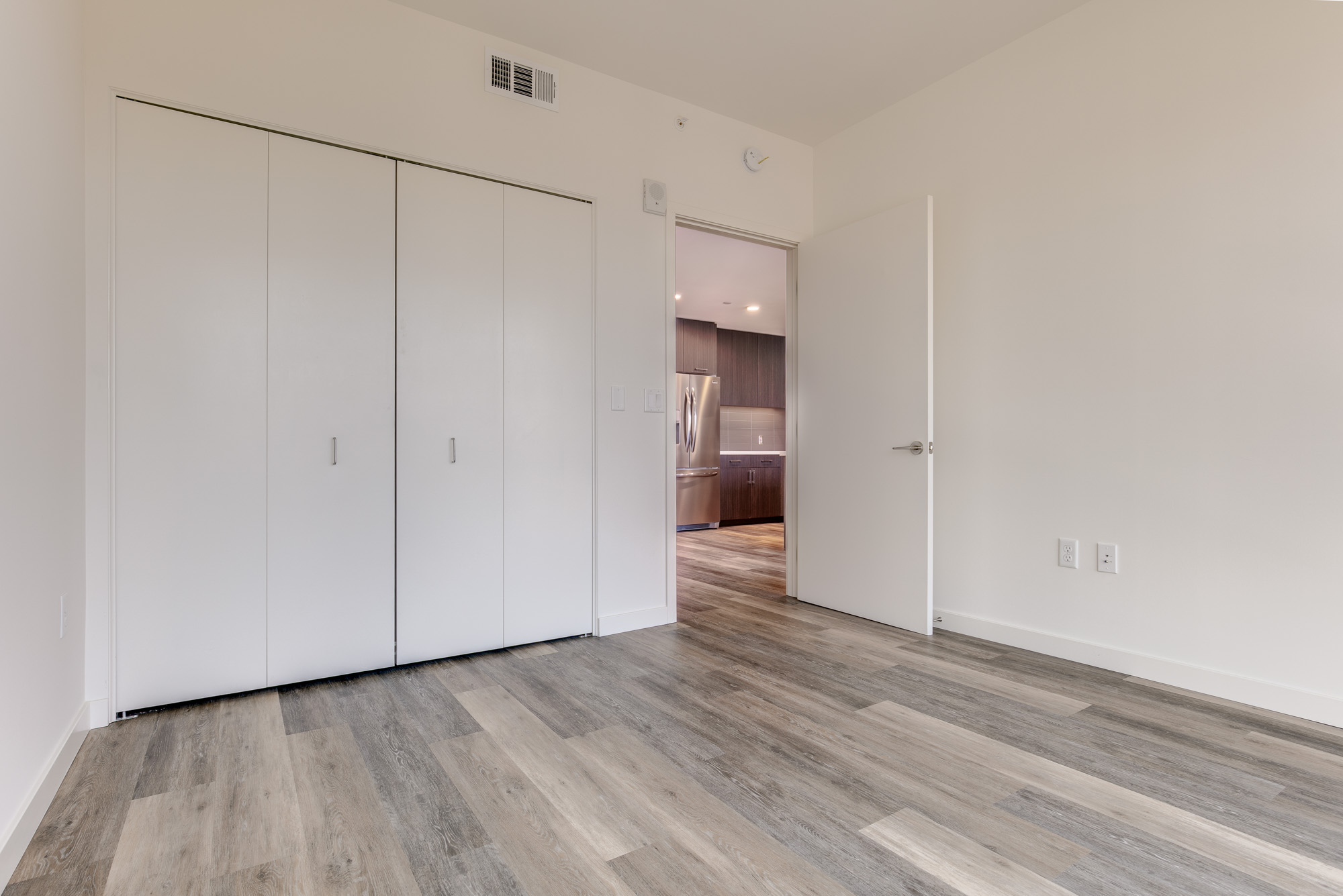 Bedroom space at The Merian Apartments in San Diego, California.