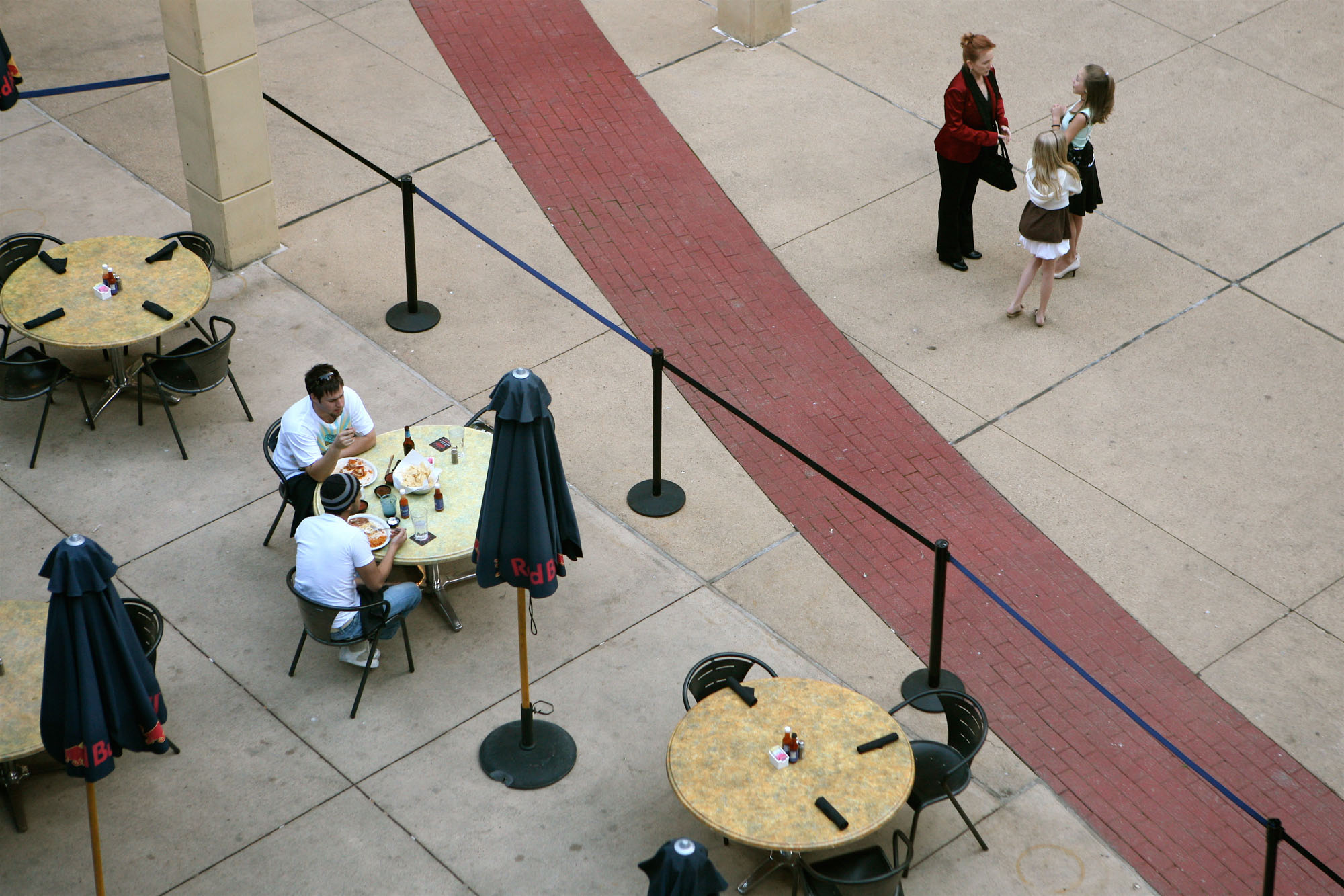 Outdoor dining near The Merc apartments in Mercantile Place in Dallas, TX