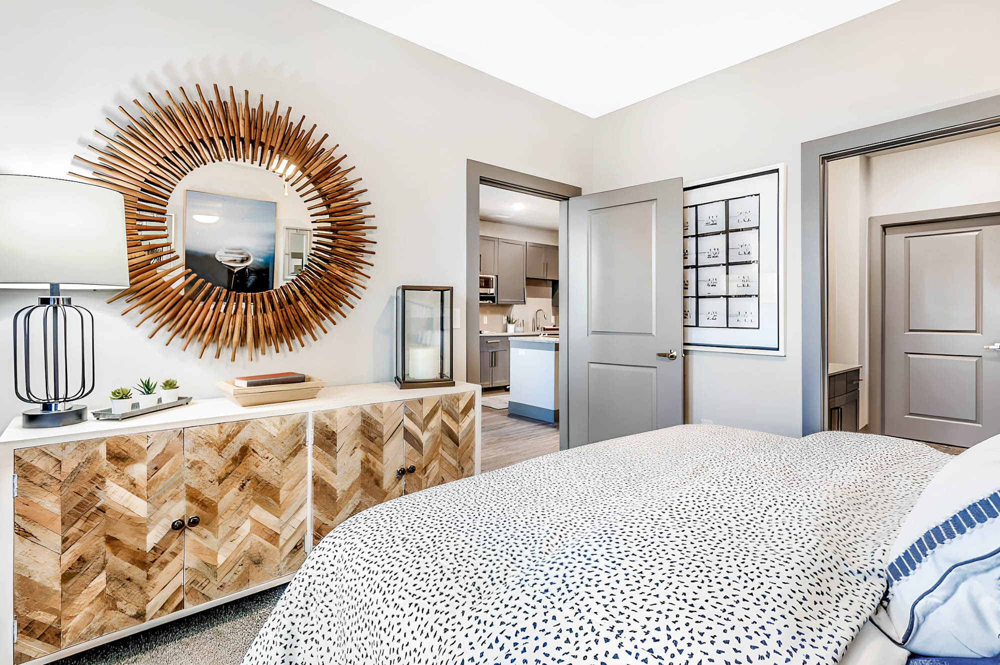 The bedroom of an apartment at Embree Hill in Dallas, TX.