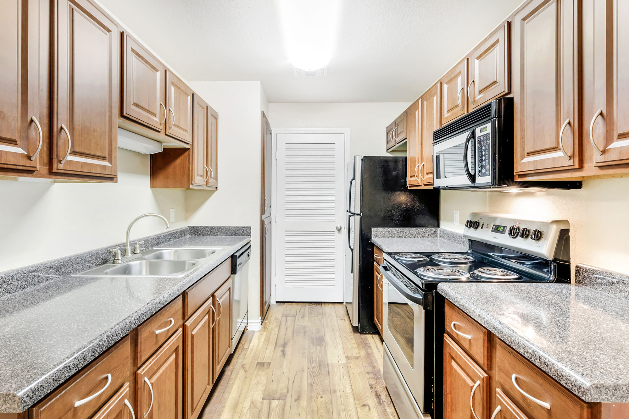 The kitchen in an apartment at The Gables of McKinney in McKinney, TX.