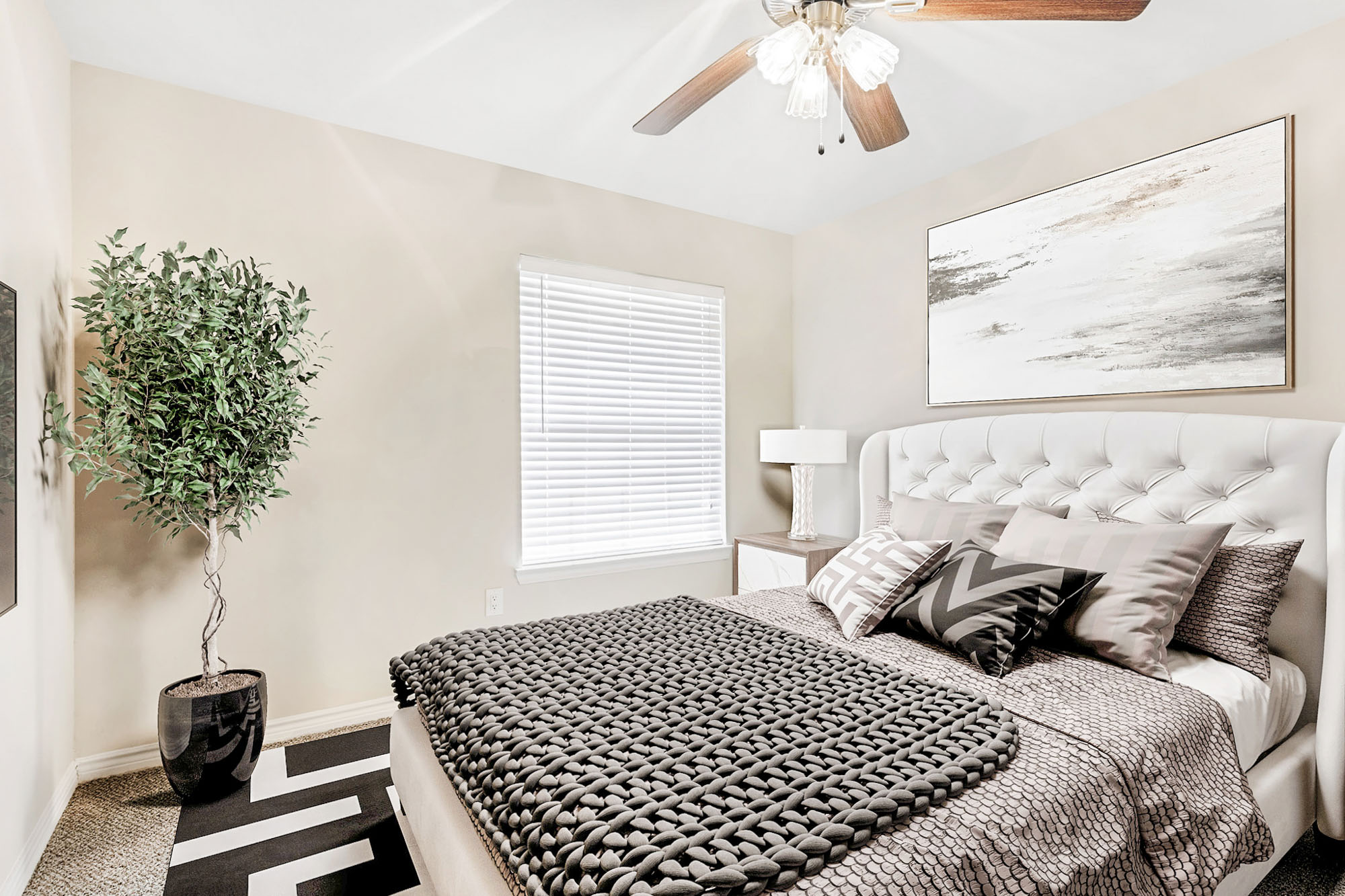 The bedroom in an apartment at The Gables of McKinney in McKinney, TX.