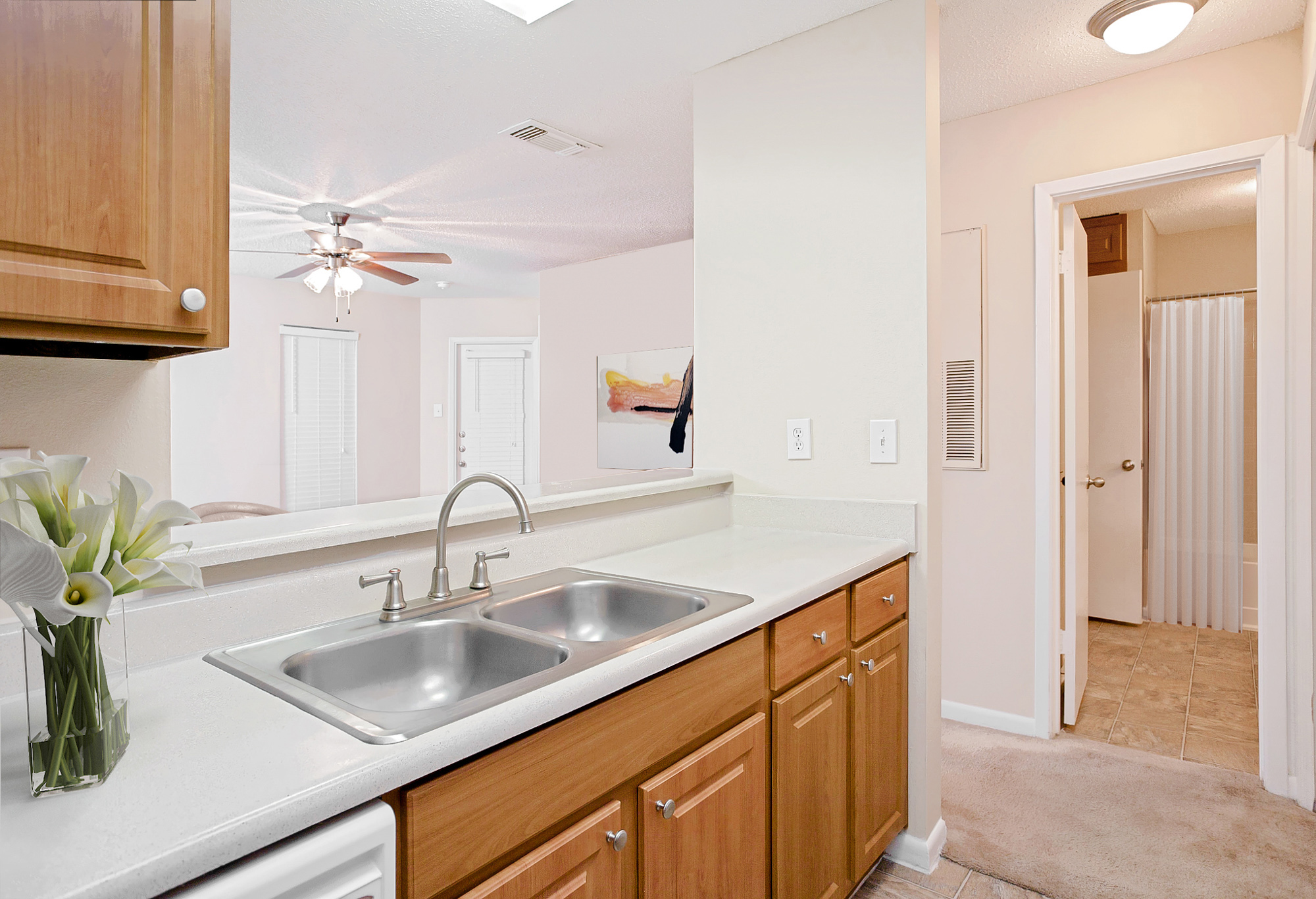 The kitchen of an apartment at The Arbors of Wells Branch in Austin, TX.