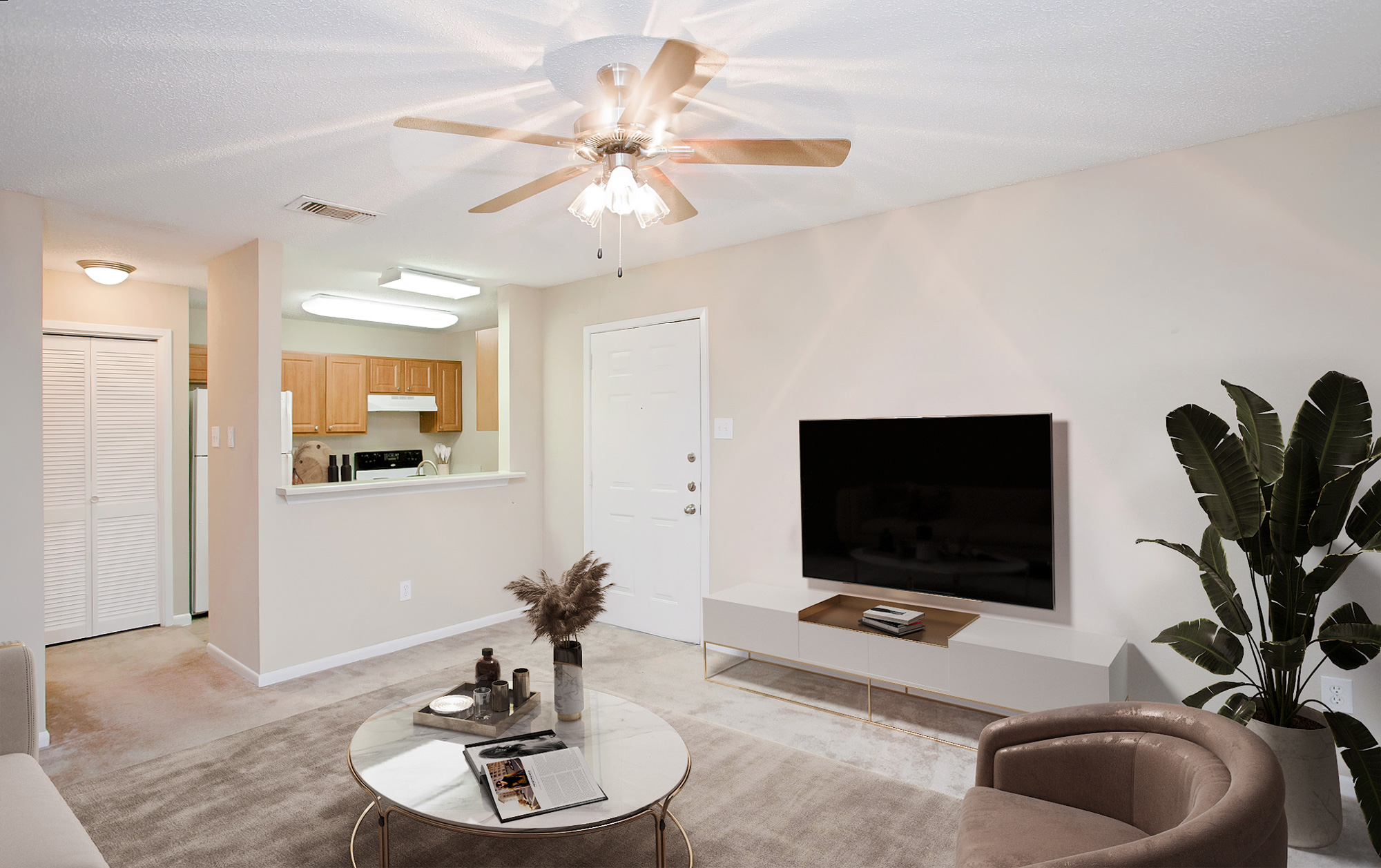 The living area of an apartment at The Arbors of Wells Branch in Austin, TX.