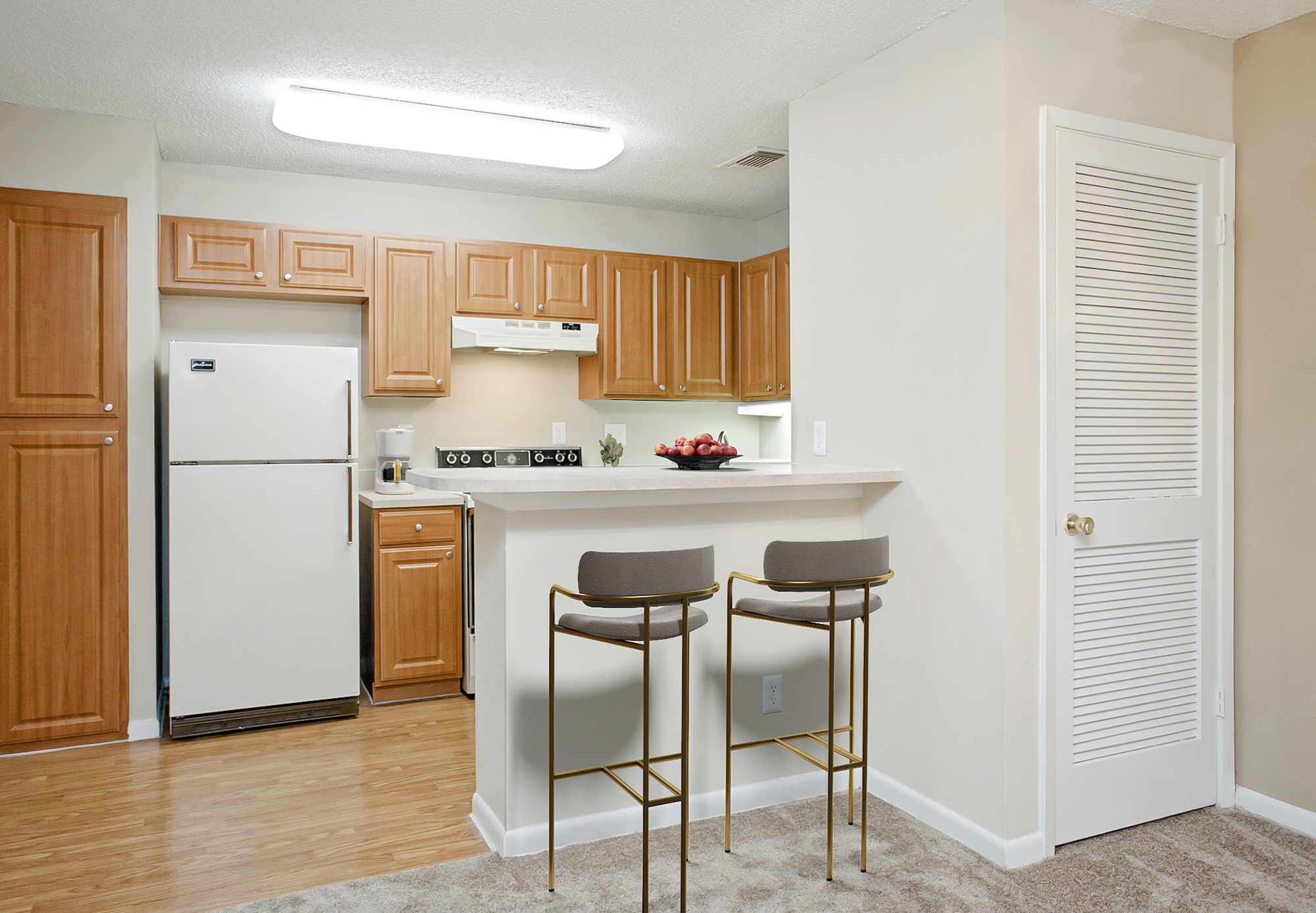 The kitchen of an apartment at The Arbors of Wells Branch in Austin, TX.