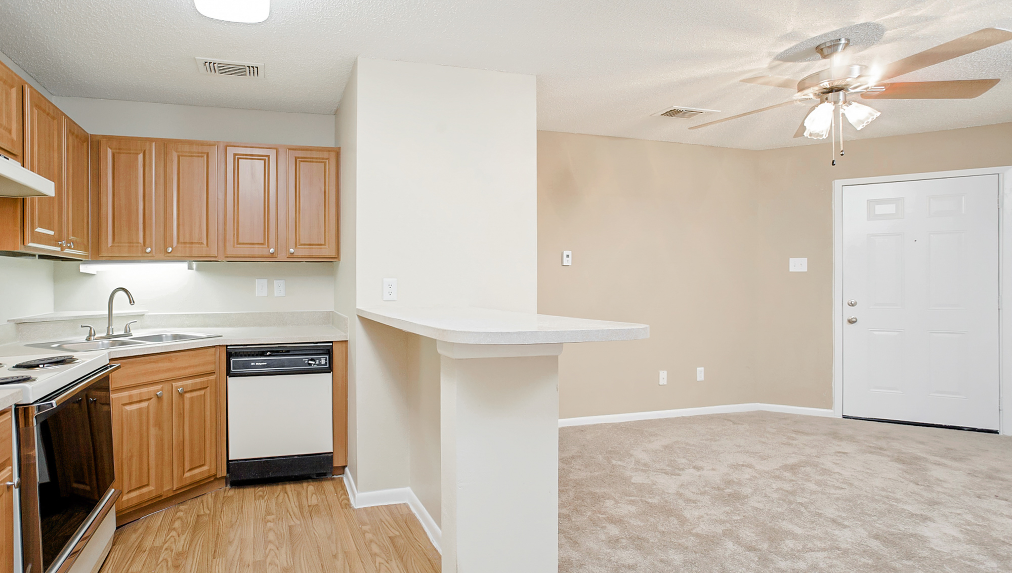 The living area of an apartment at The Arbors of Wells Branch in Austin, TX.