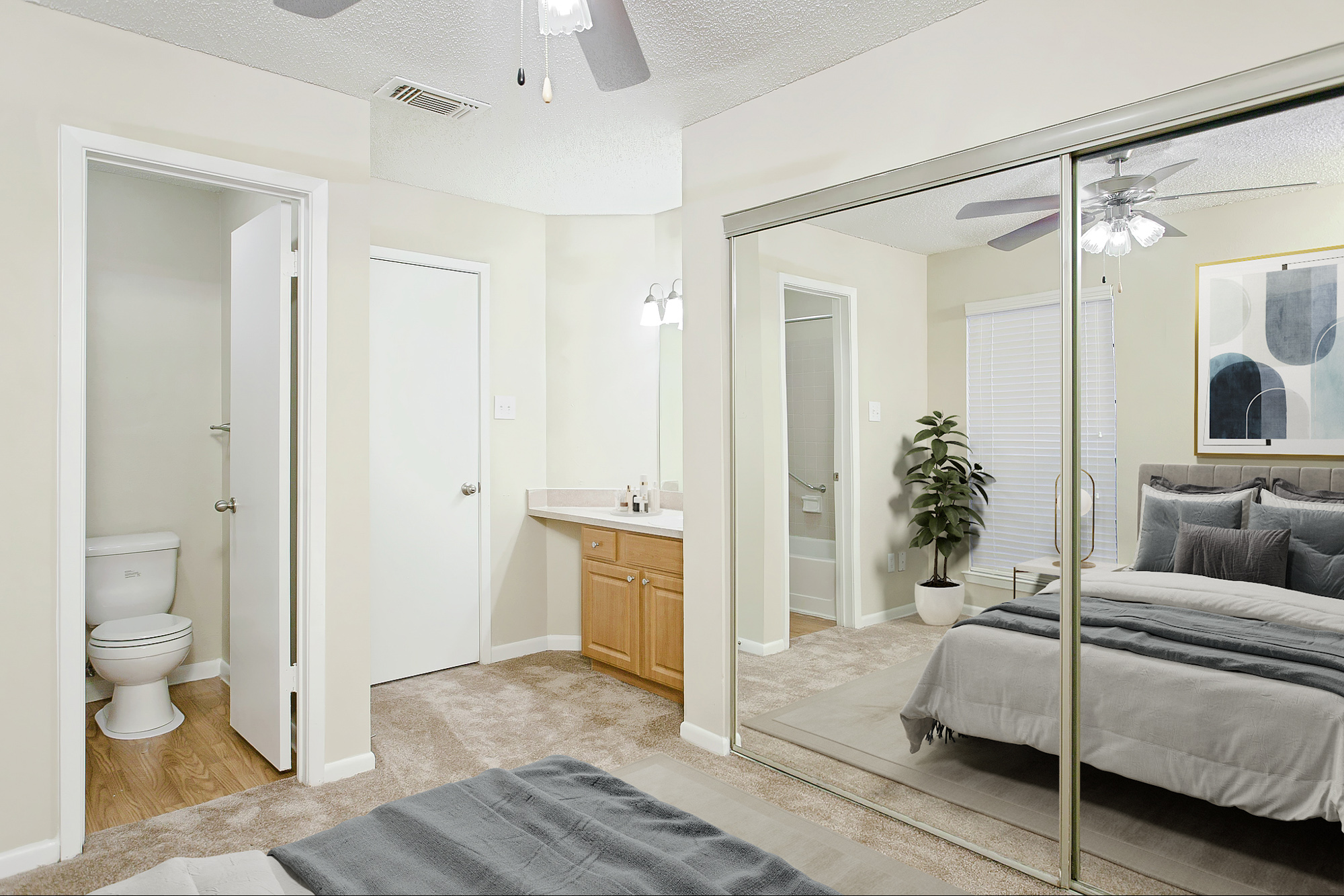 The bedroom of an apartment at The Arbors of Wells Branch in Austin, TX.