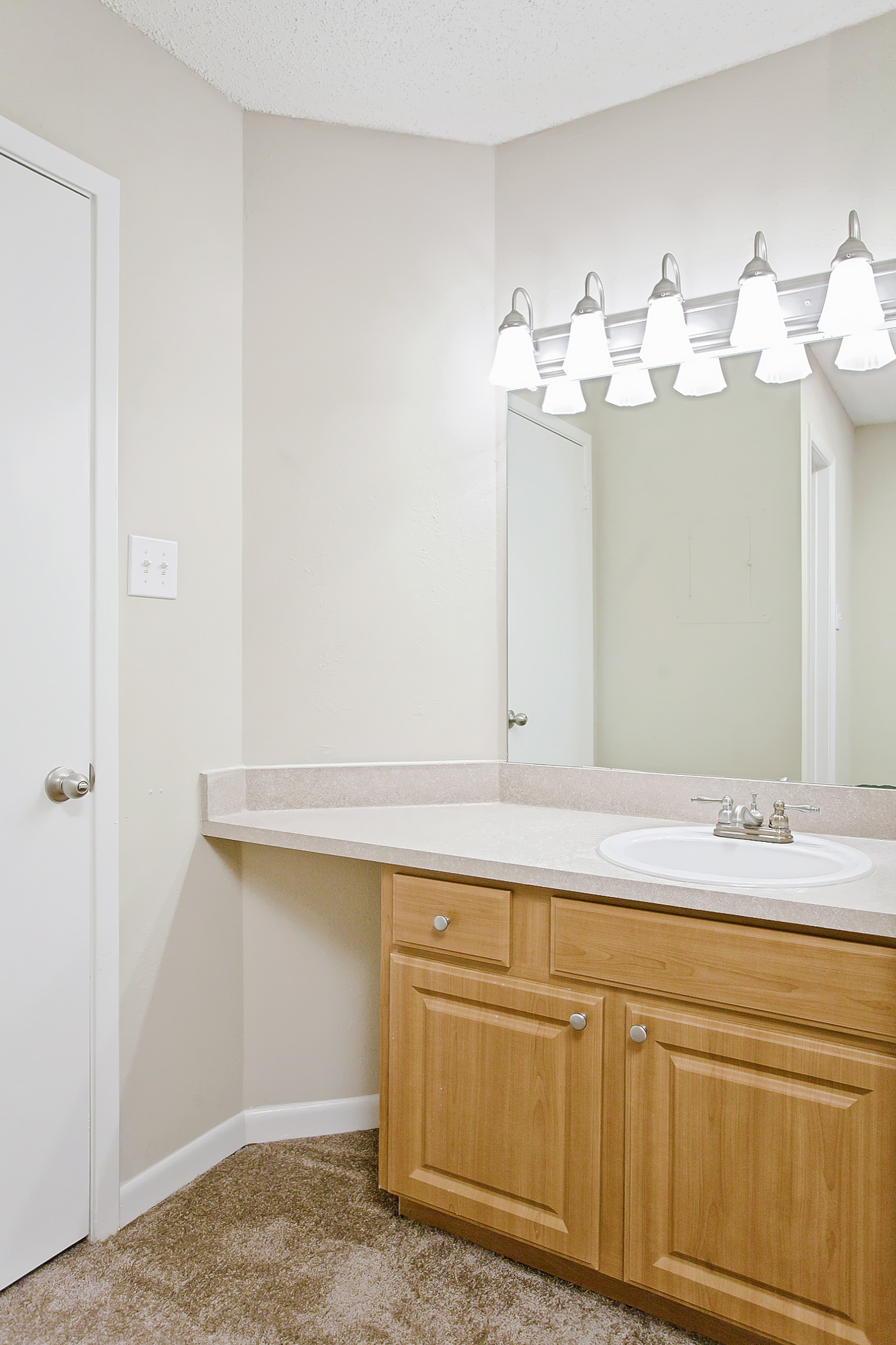 The bathroom of an apartment at The Arbors of Wells Branch in Austin, TX.