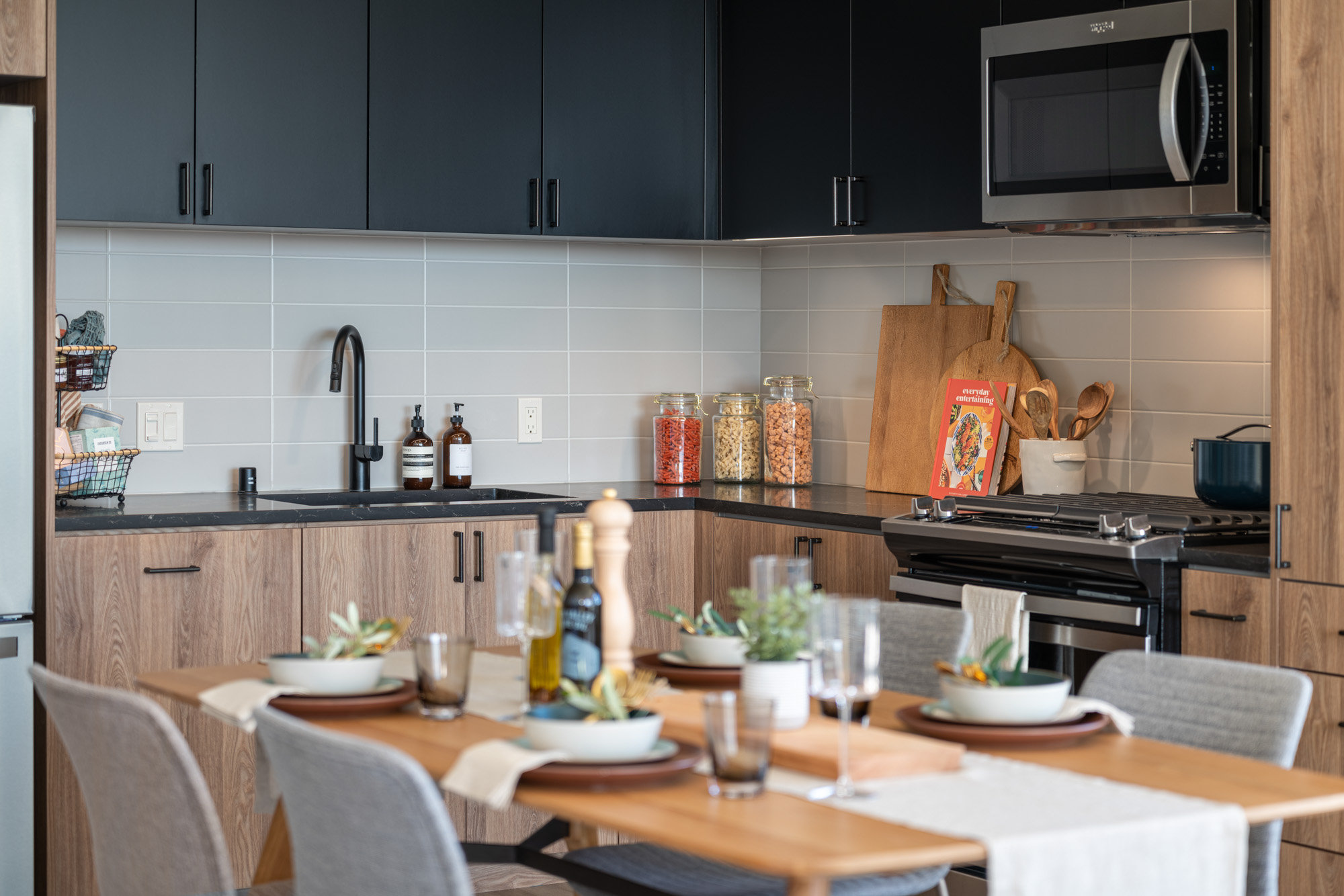 An apartment dining area and kitchen at The George apartments in San Francisco, CA