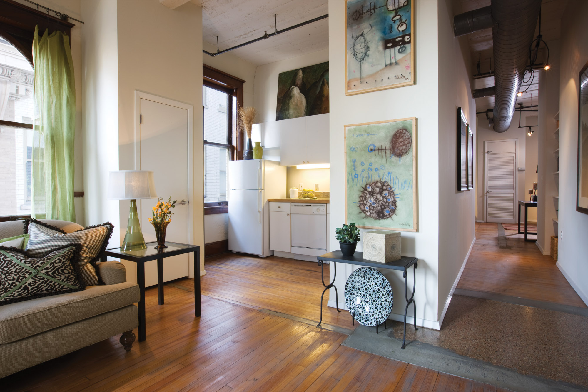 Kitchen and hall at The Wilson apartments in Mercantile Place in Dallas, TX