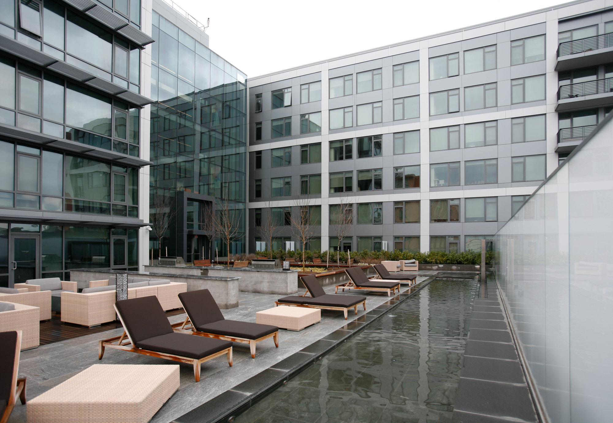 The outdoor terrace with lounges and water feature at Twelve12 in Navy Yard, Washington DC.