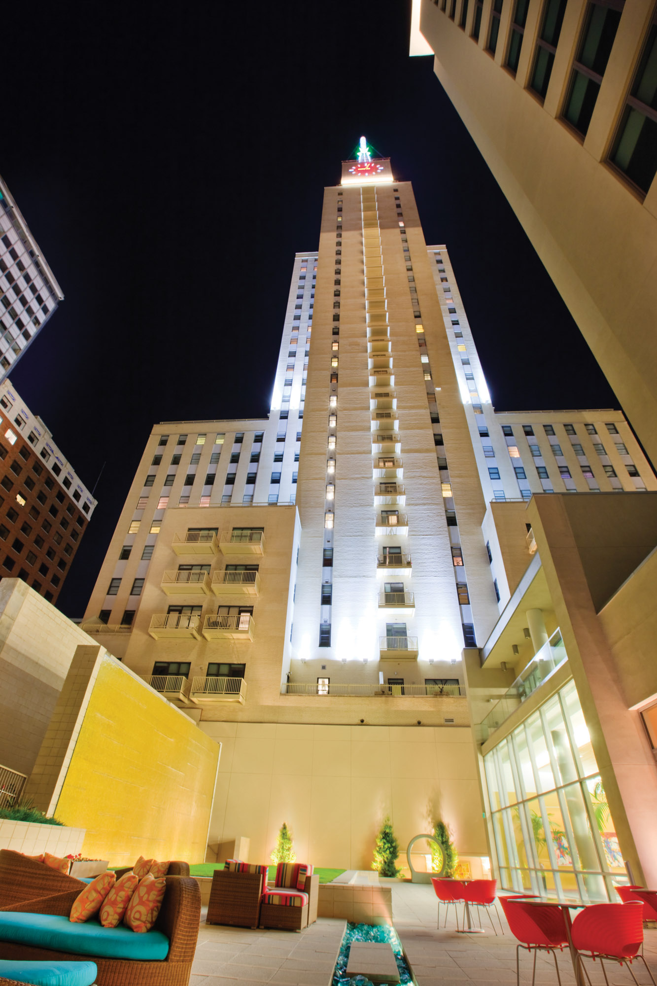 Nightime at the pool patio of The Element apartments in Dallas, TX.