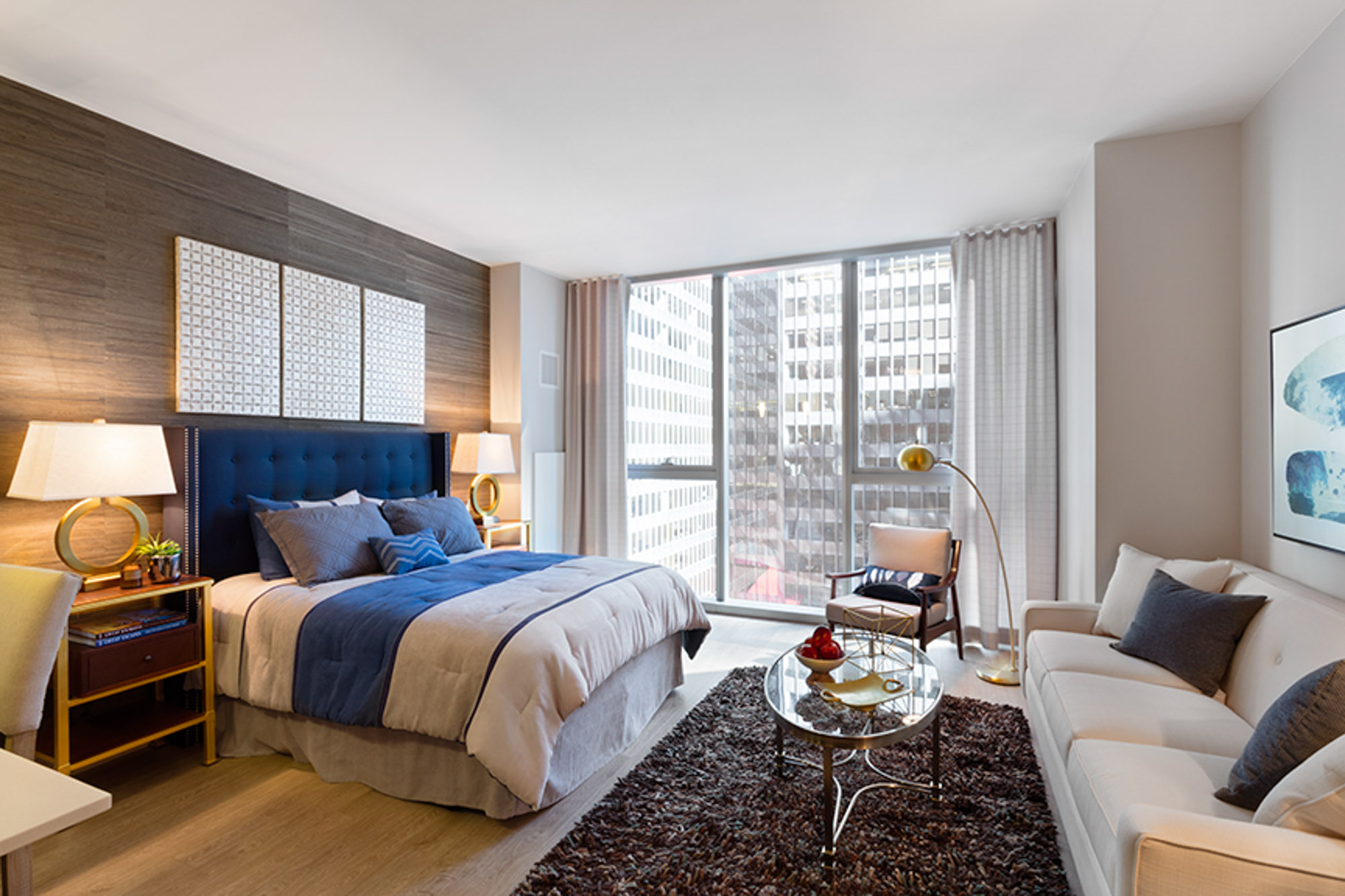 The bedroom in an apartment at MILA in Chicago, Illinois.