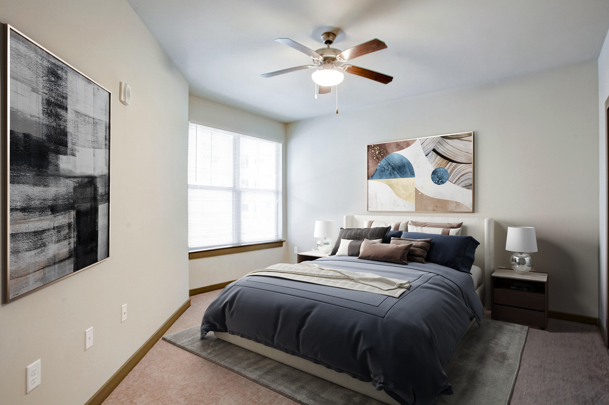 A blue duvet sits on top of a bed in Park 9 apartments near Atlanta, GA.