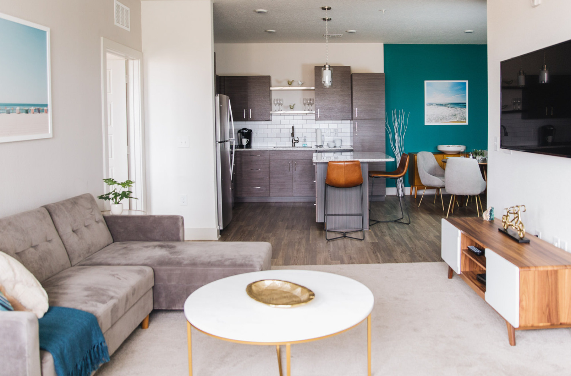 A living room and kitchen in Domain apartments in Kissimmee, Florida.