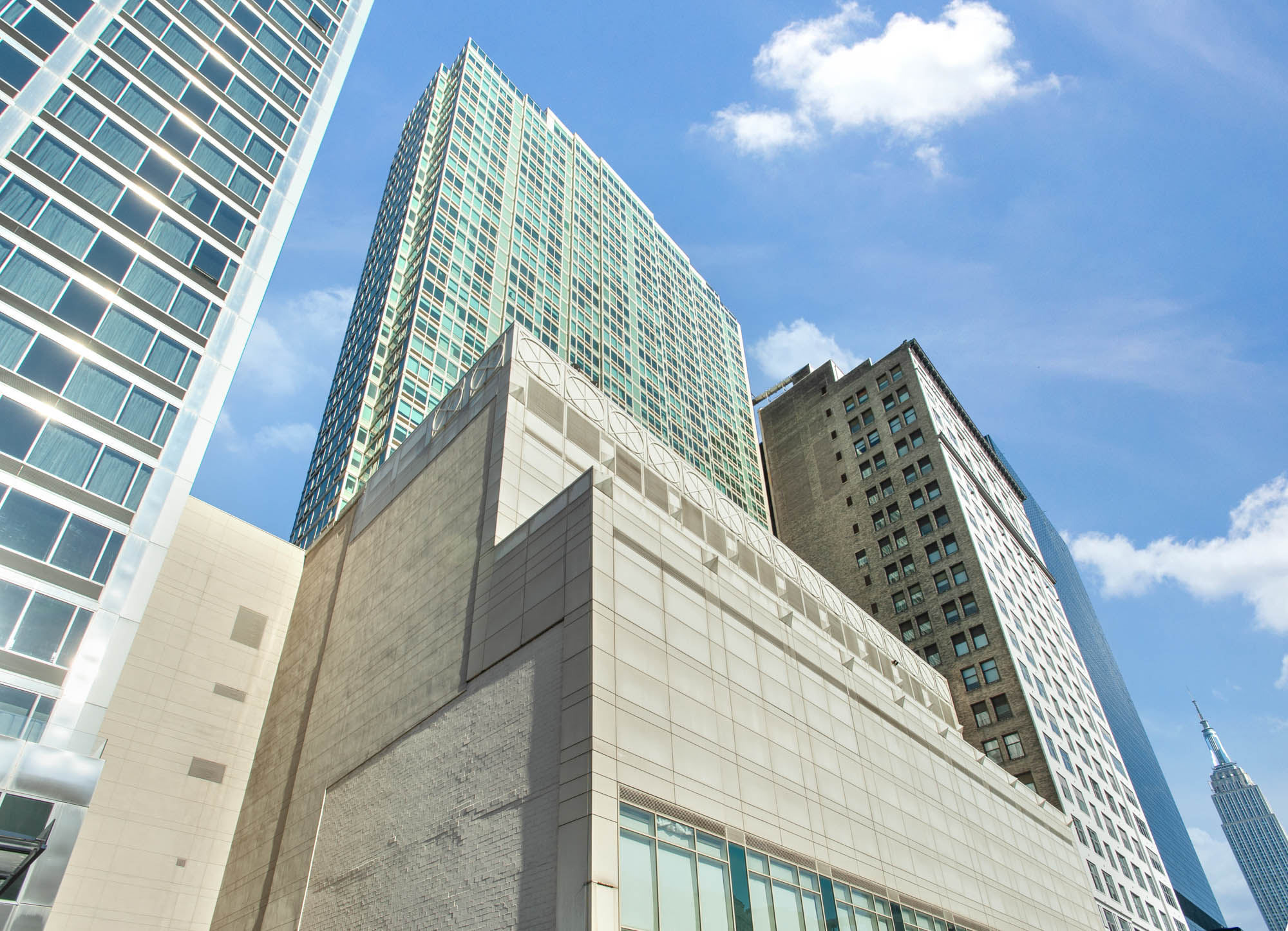 An image looking up at The Olivia building in Manhattan, NYC.