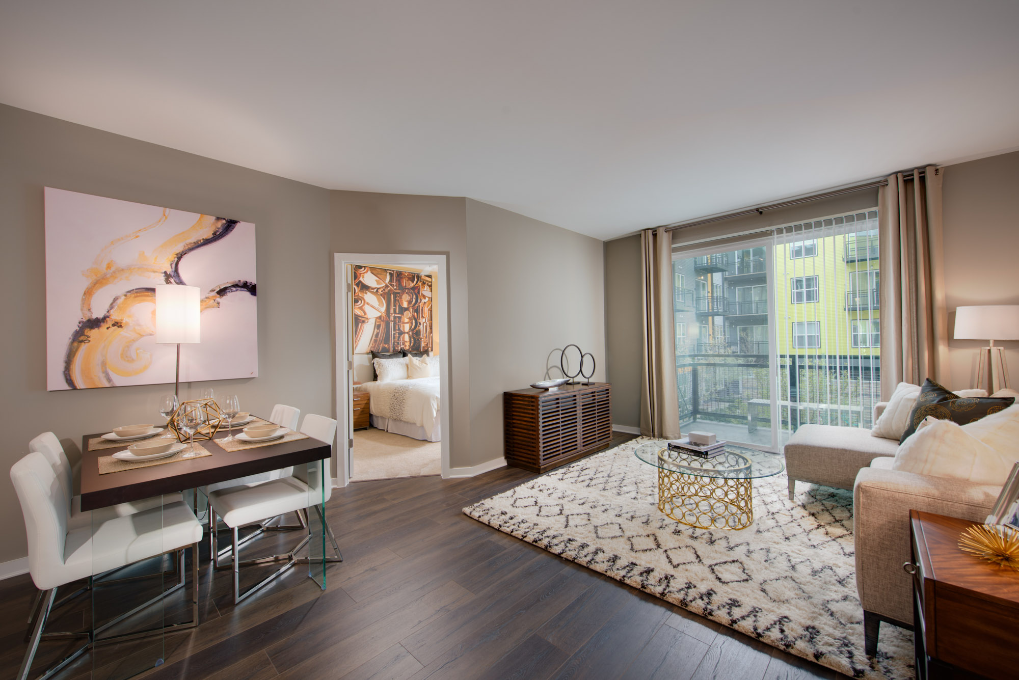 A living room and dining area in The Parker at Huntington Metro apartment in Alexandria, VA.