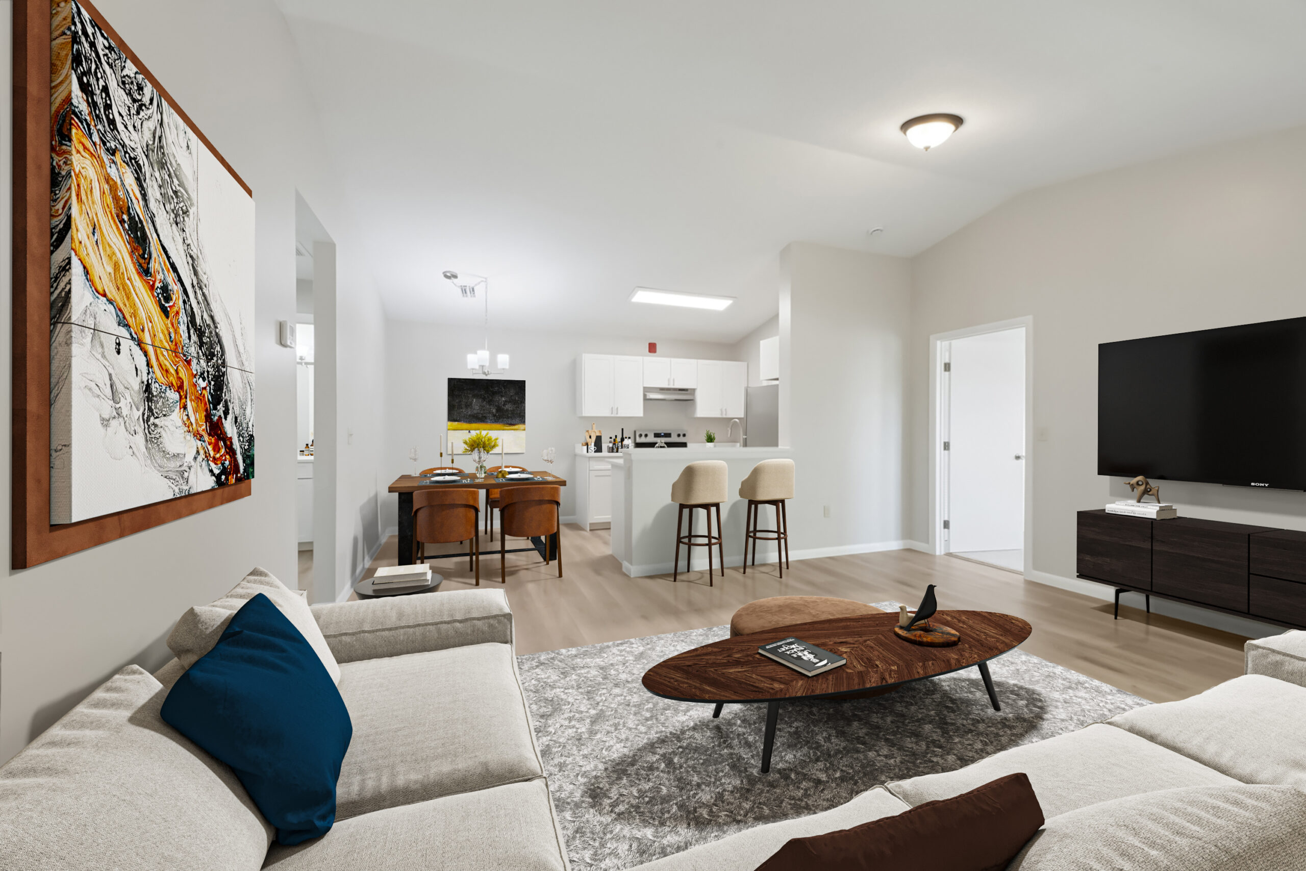 A modern living room with a large flat screen tv.