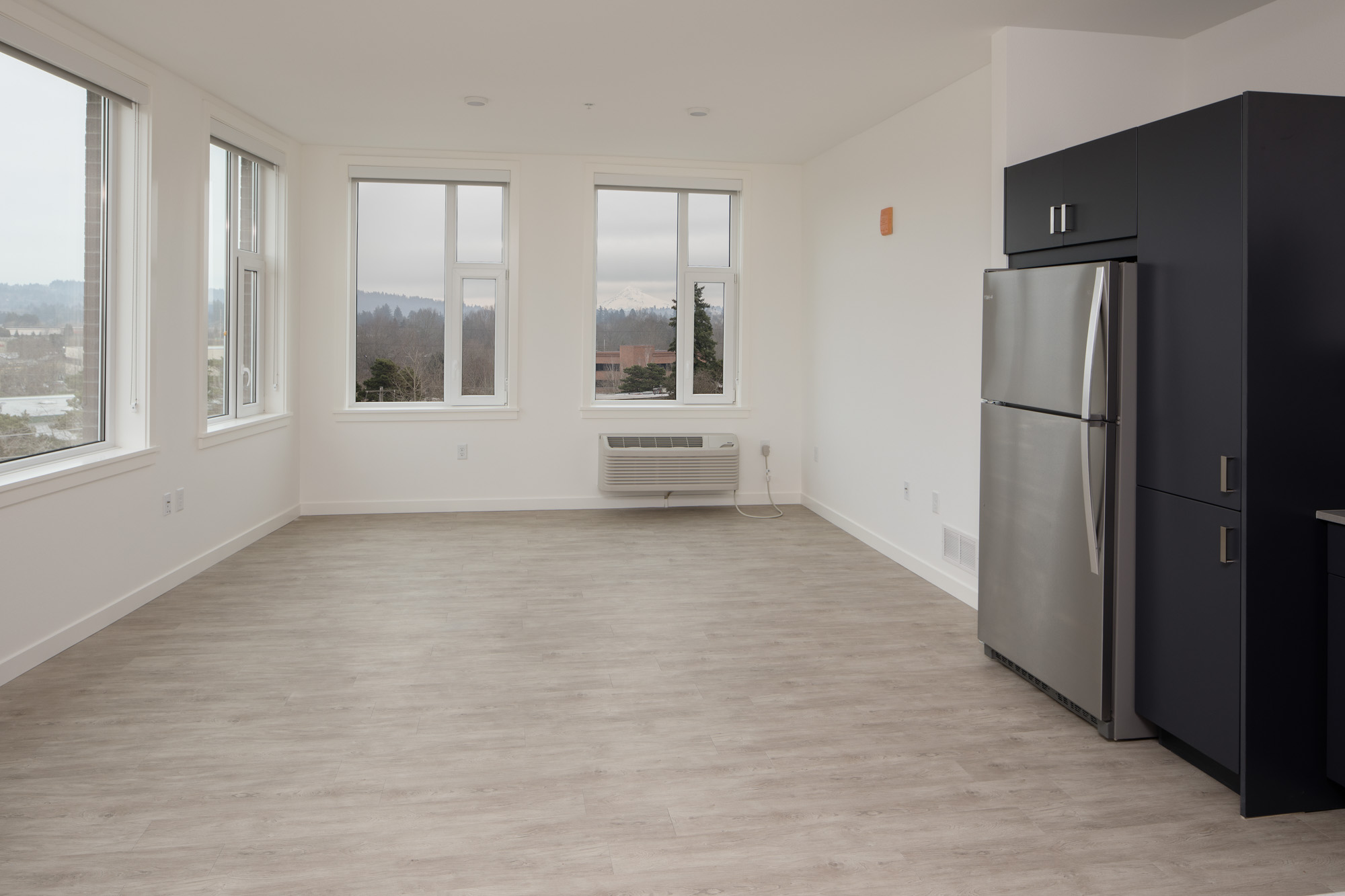 A kitchen and living room in Verso apartments in Beaverton, Oregon.