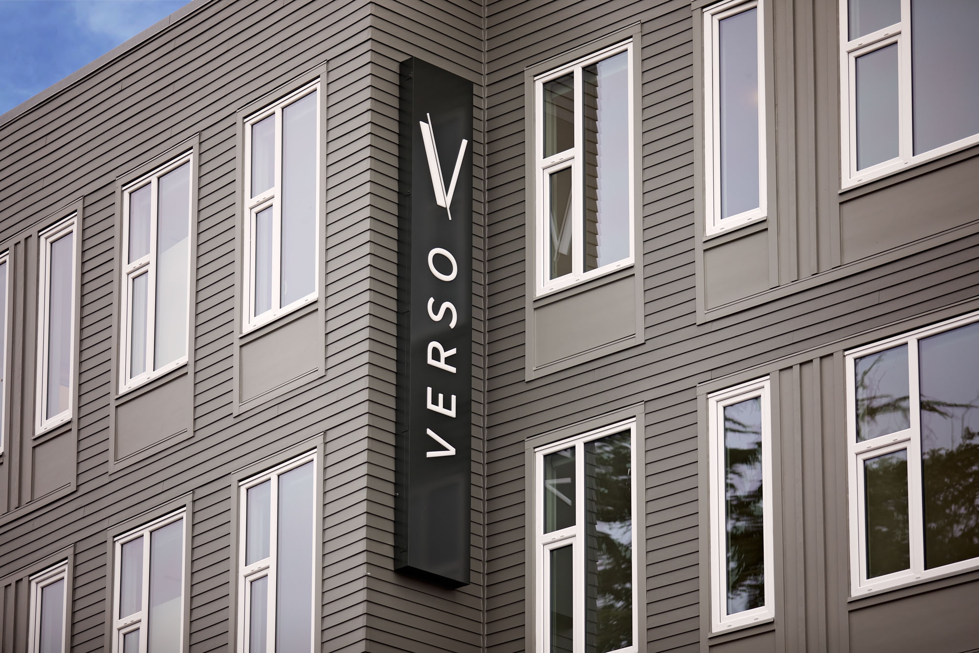 The apartment building facade with logo at Verso apartments in Beaverton, Oregon.