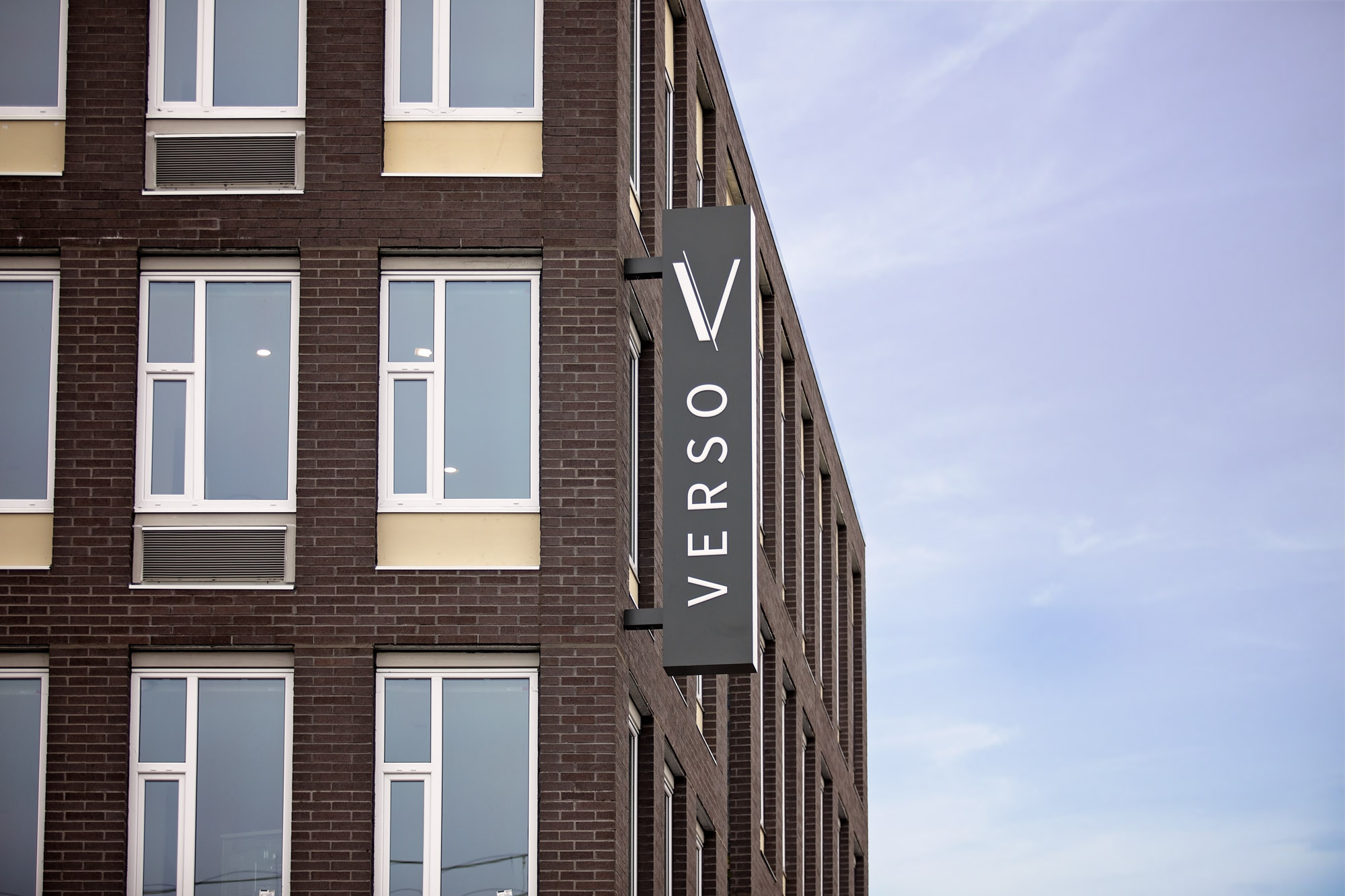 The apartment building facade with logo at Verso apartments in Beaverton, Oregon.