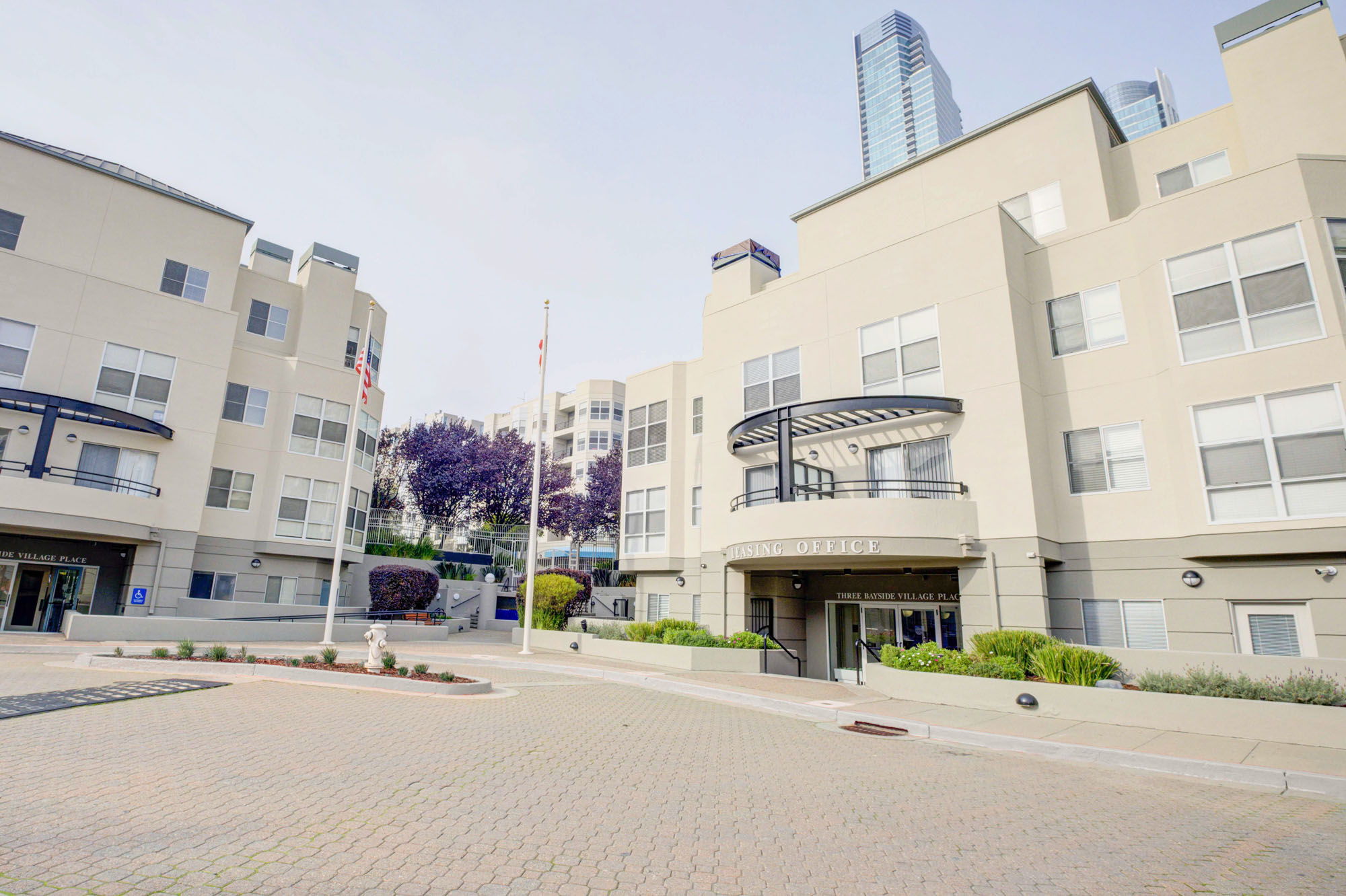 A courtyard in front of the leasing office of the Bayside Village apartments in San Francisco