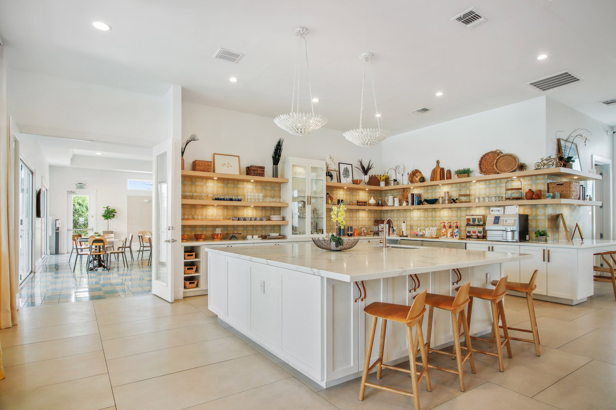 The clubhouse at Domain apartments with a gourmet kitchen in Kissimmee Florida.