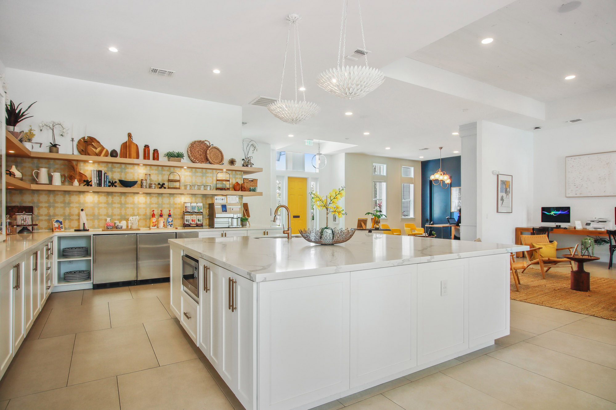 The clubhouse at Domain apartments with a gourmet kitchen in Kissimmee Florida.