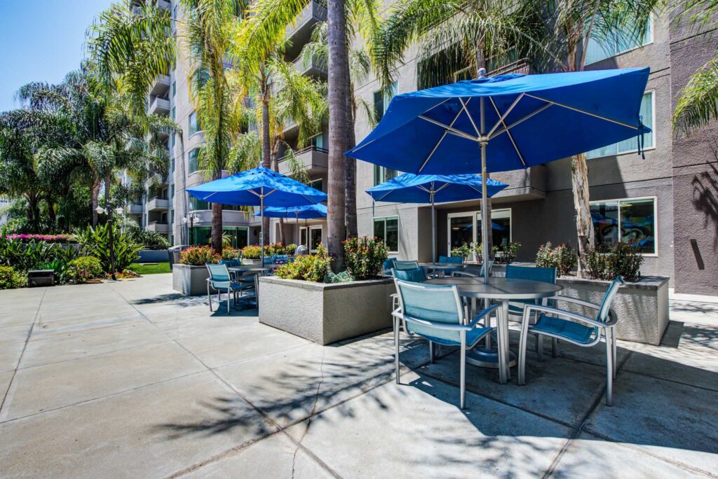 Outdoor seating with umbrellas at The Met in downtown LA